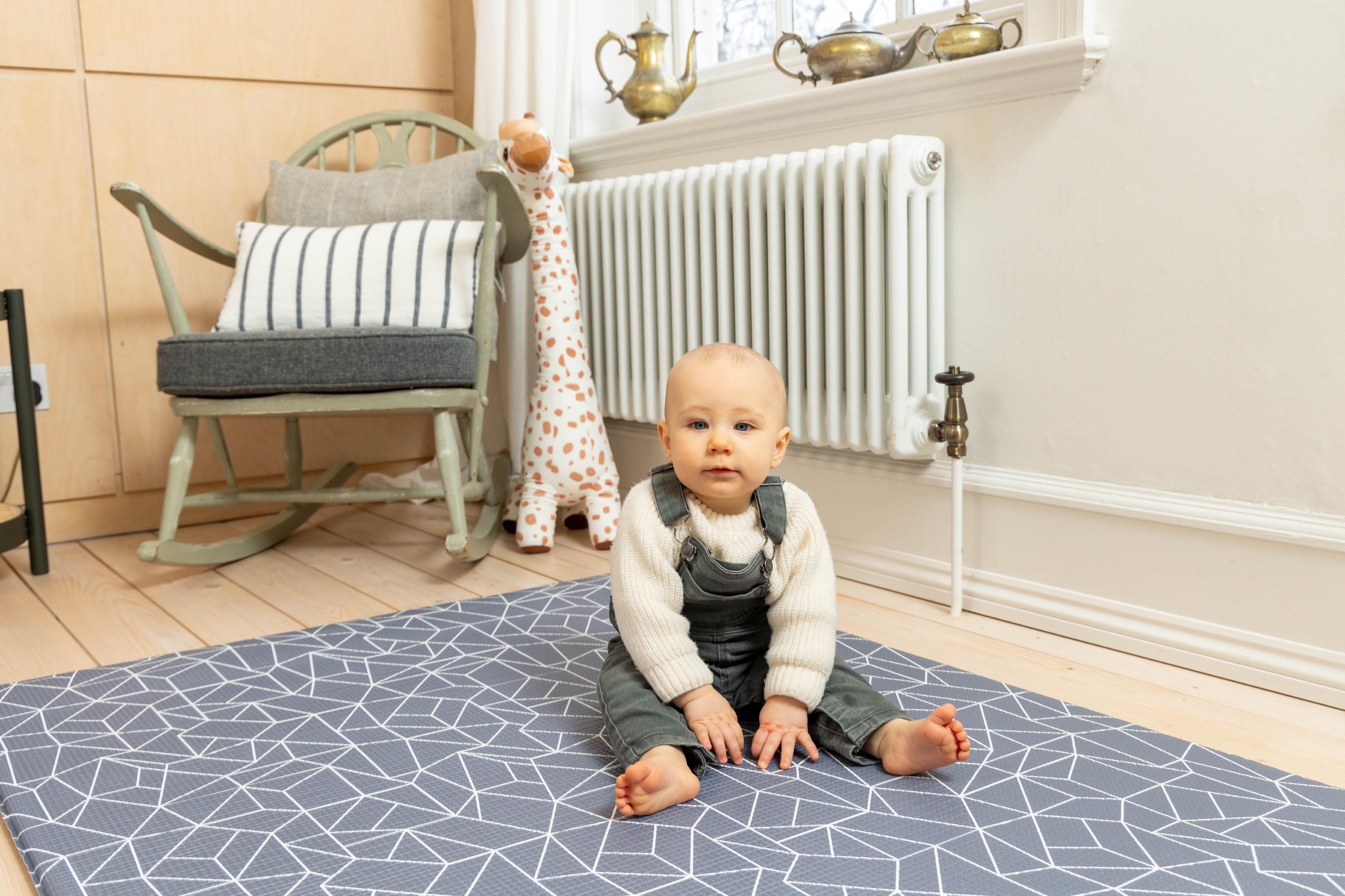 Scandi-inspired Nordic Explorer Playmat in Storm Grey shown in natural lighting