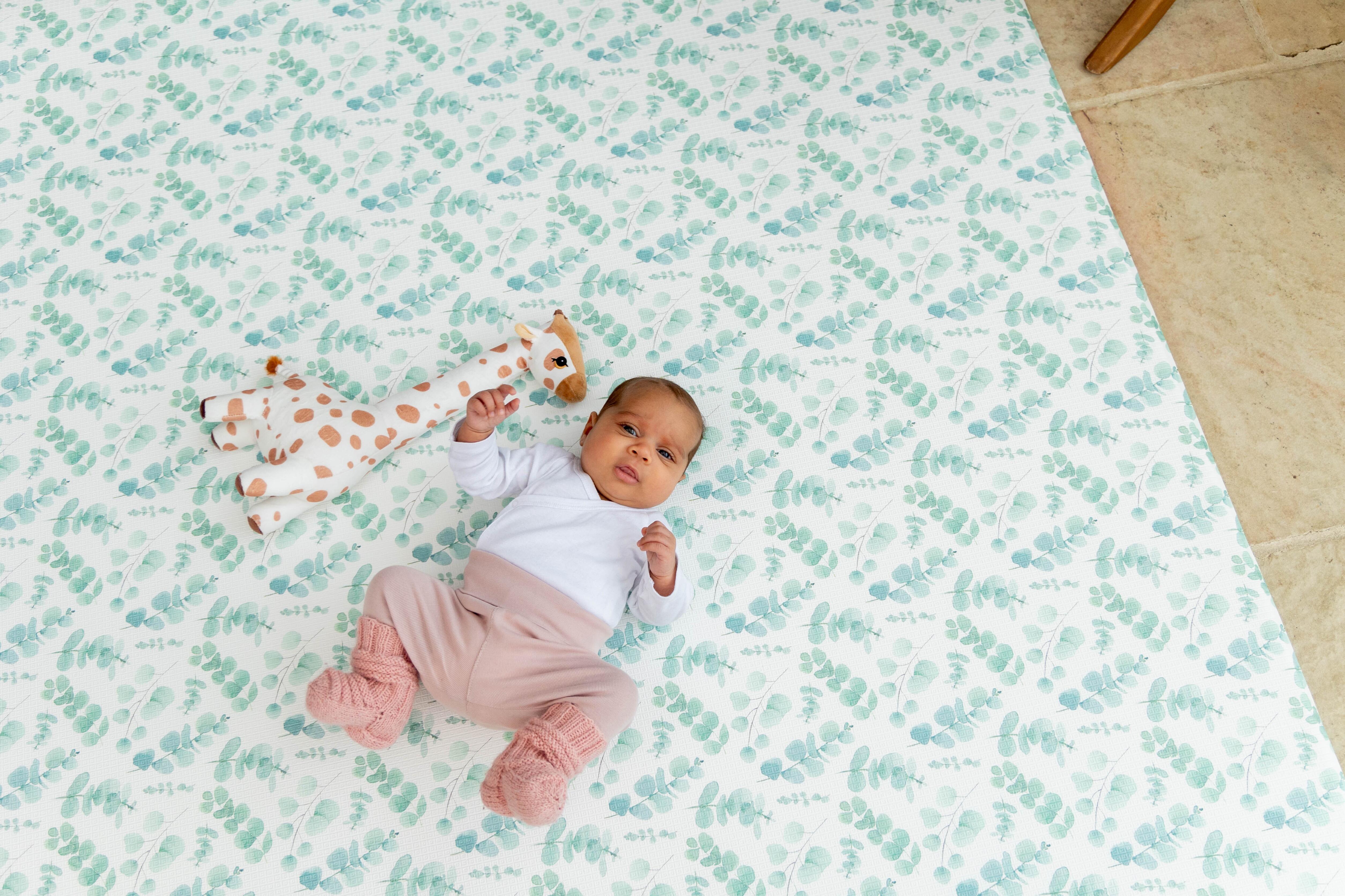 Fresh Eucalyptus Playmat in Botanical Green rolled neatly for simple storage
