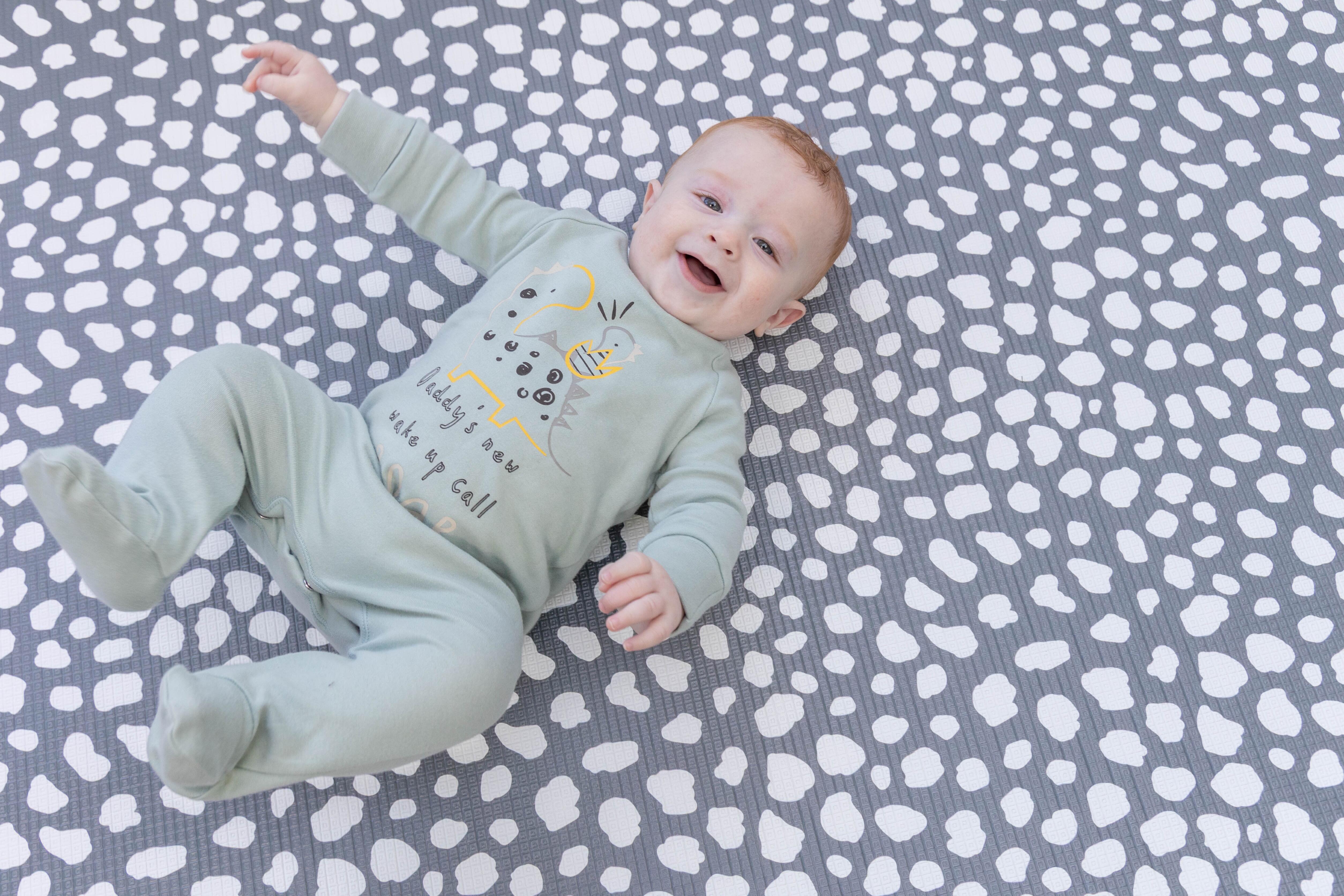 Medium Darling Dalmatian Playmat in Storm Grey rolled neatly for storage