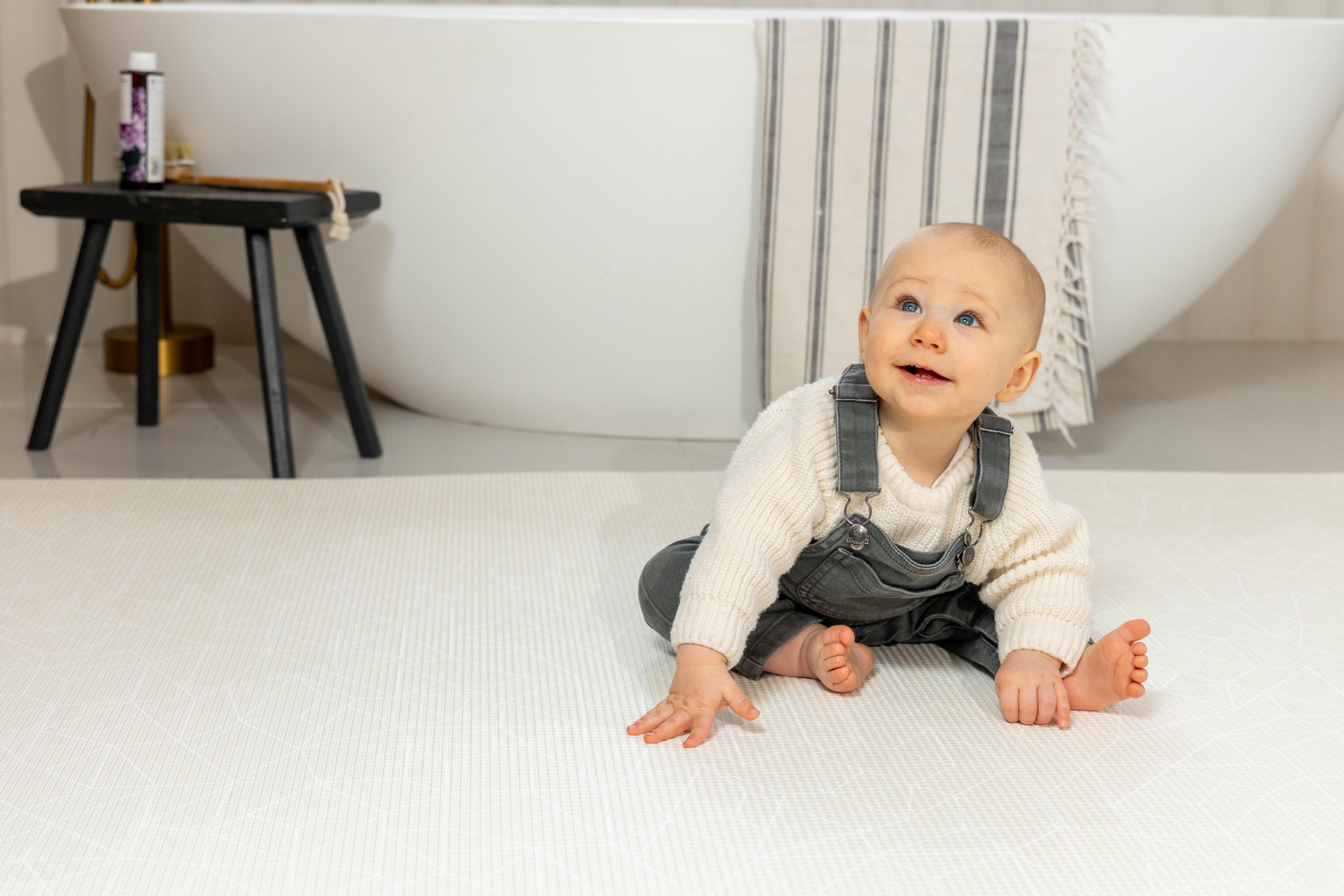 Lifestyle photo of Nordic Explorer Cornish Cream playmat β reversible cushioned foam baby mat by Little Fae