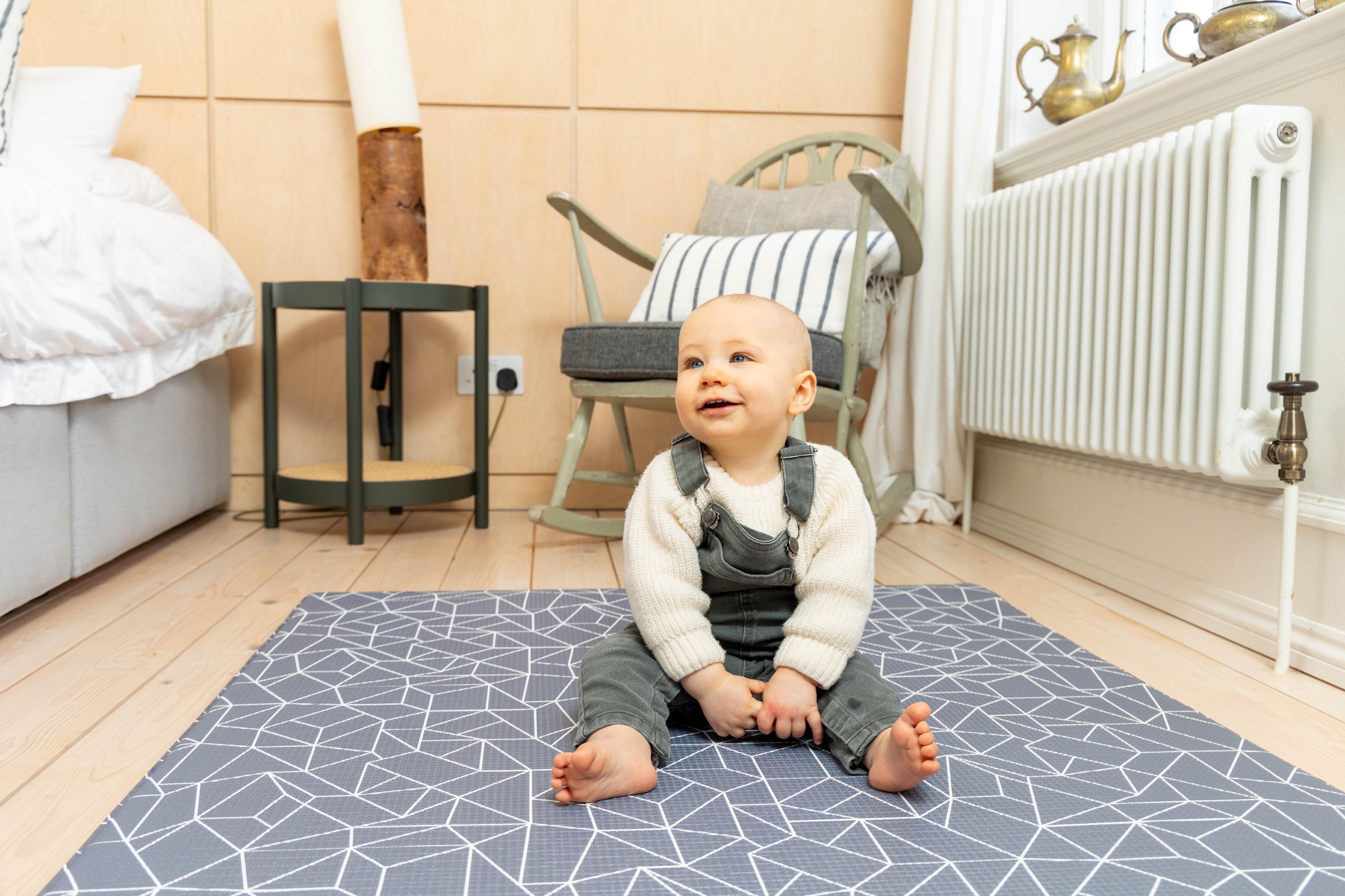 Reversible Nordic Explorer Playmat – Storm Grey design offering comfort and safety for babies and toddlers.