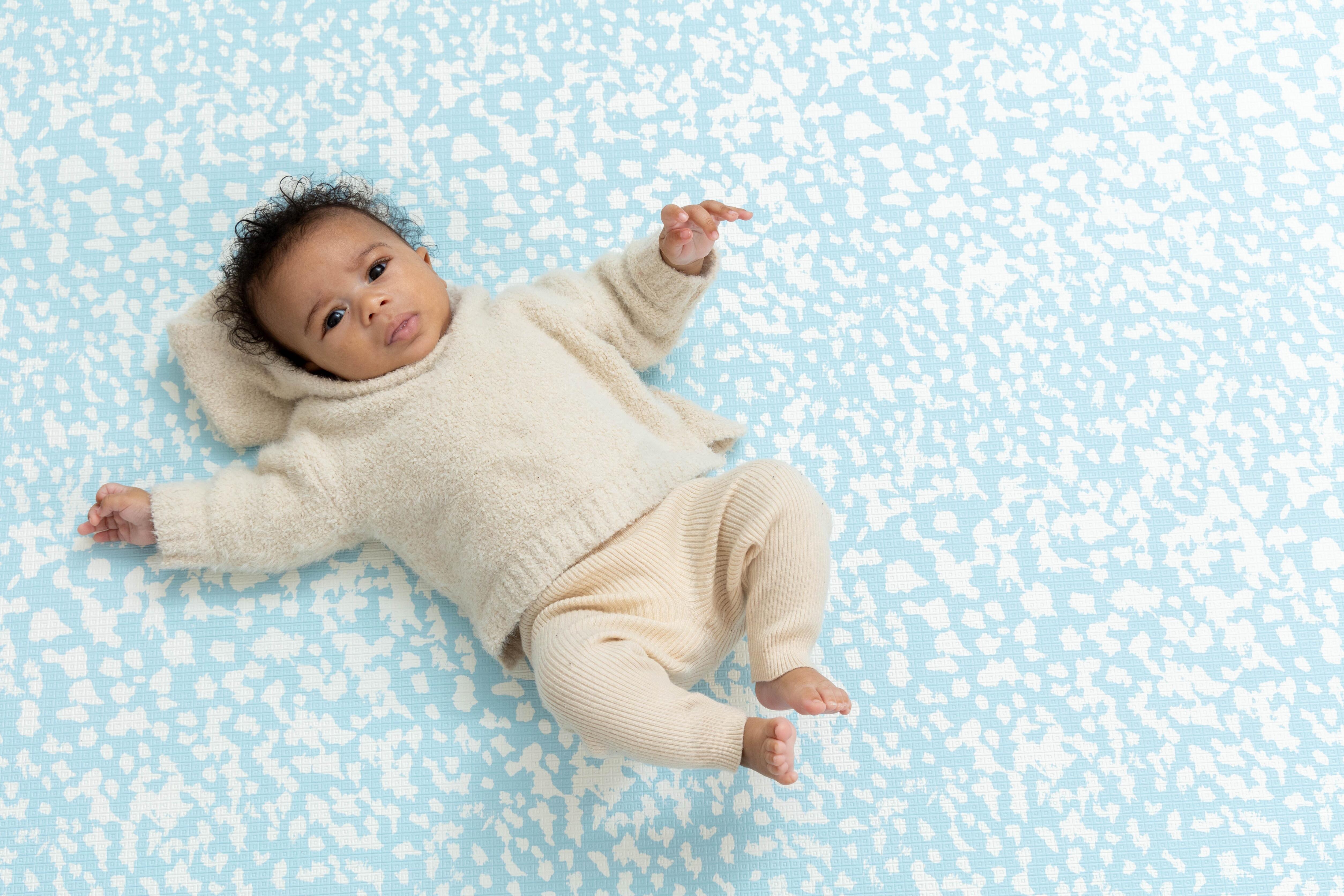Speckled Kisses Reversible Playmat β Chalk Blue side featuring soft pattern detailing and a minimal aesthetic.