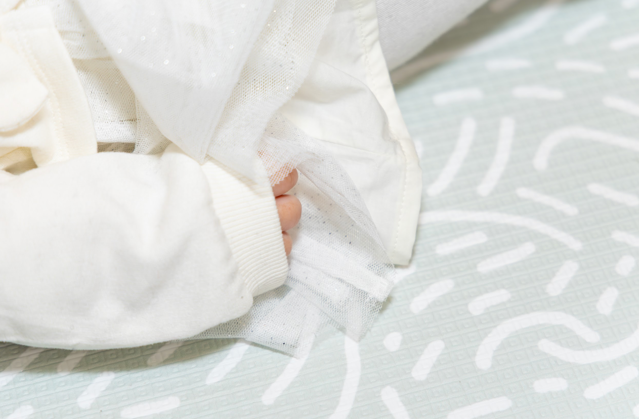 Reversible Adventurer Playmat in Soft Sage – luxury baby playmat featuring subtle line detailing and calming green tones.