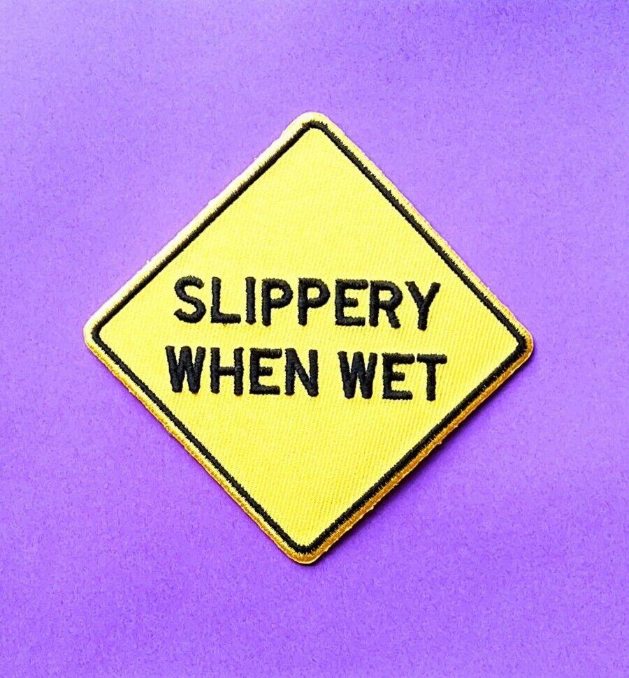 SLIPPERY WHEN WET Iron On Patch: American hazard warning sign funny message  gift