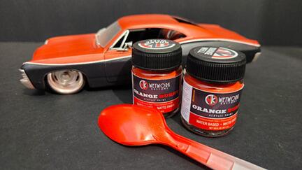 Orange Burst Acrylic Paint bottles showing professional high-visibility paint