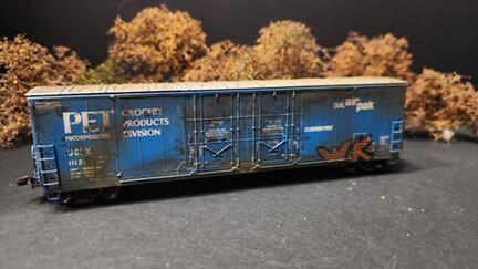 Dirty Wash weathering effects demonstration on model railroad car showing realistic rust and grime