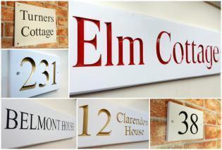 white engraved house name plates