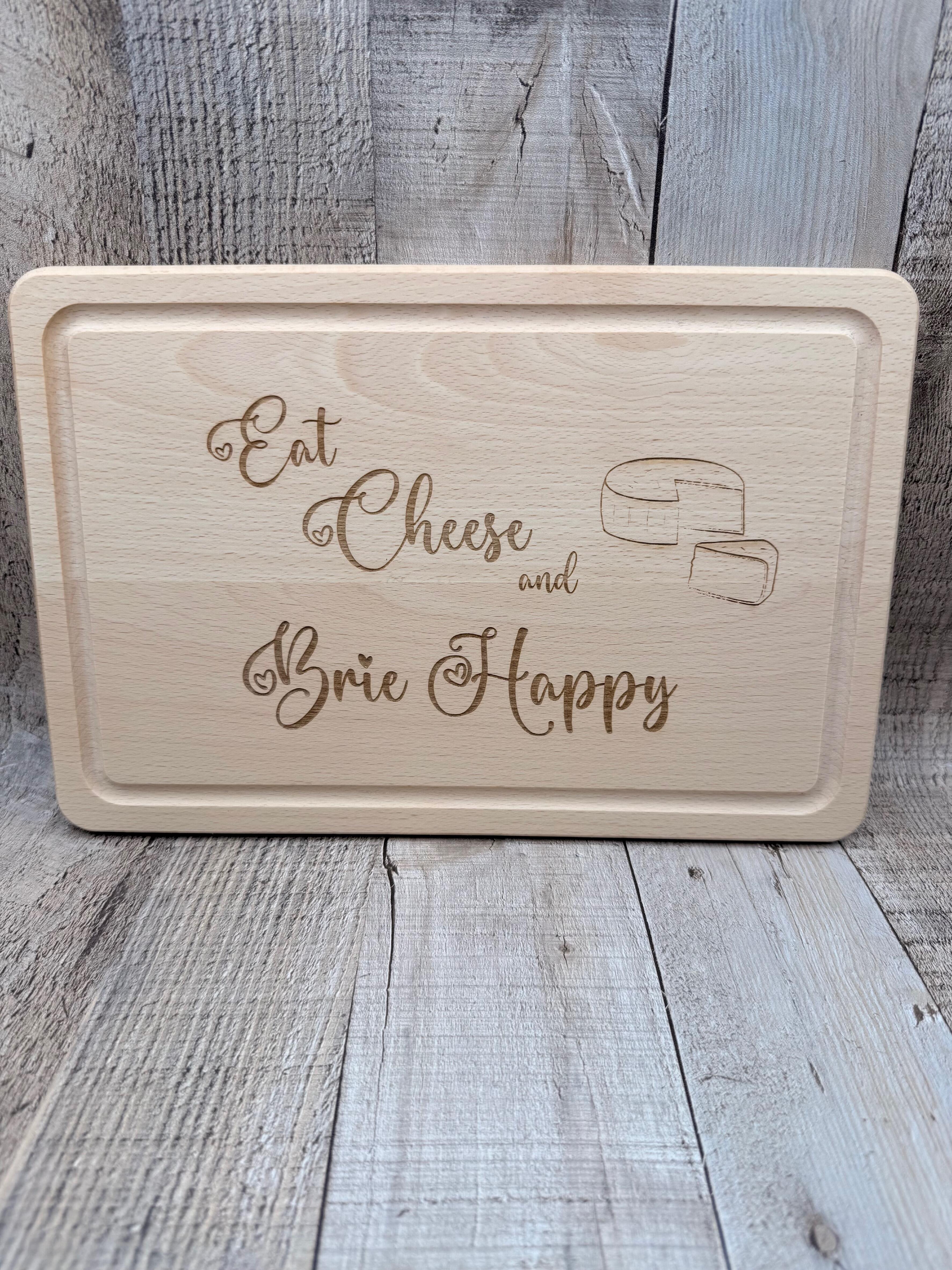 "EAT CHEESE AND BRIE HAPPY"