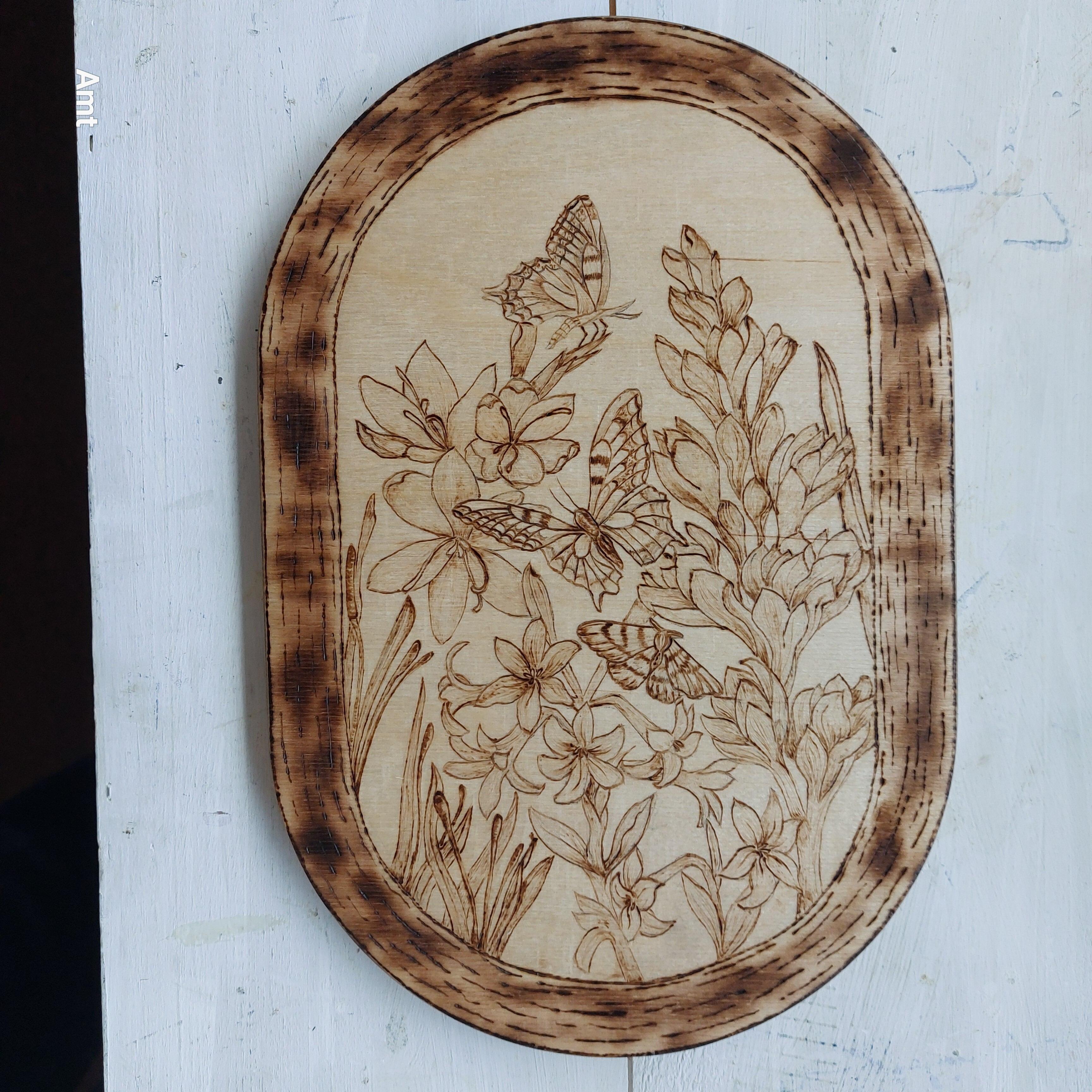 Wooden pyrography picture of butterflies and flowers