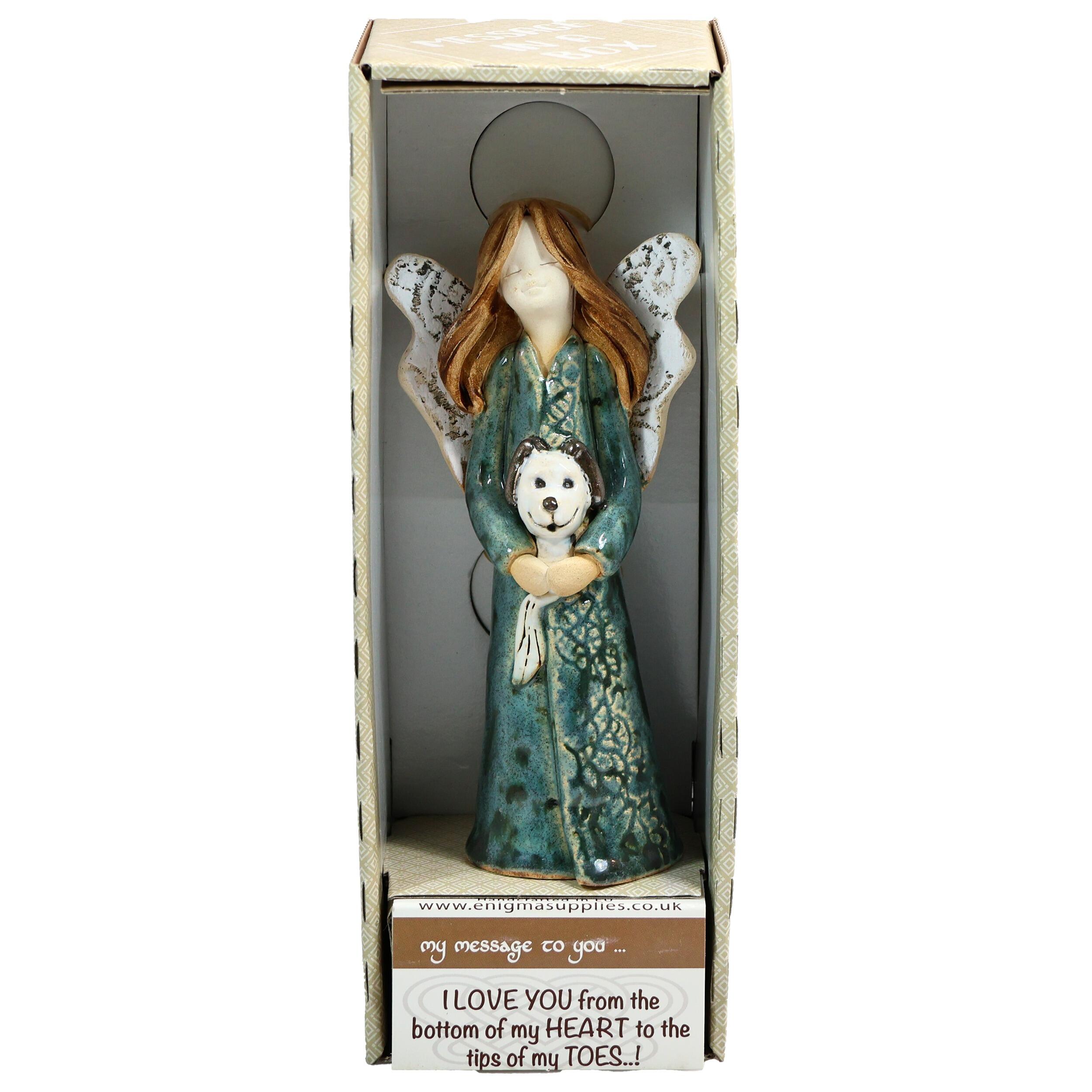 Handmade ceramic angel in a teal dress with a white dog, gift-packed. Unique ornament celebrating “The dog makes a house a home.”