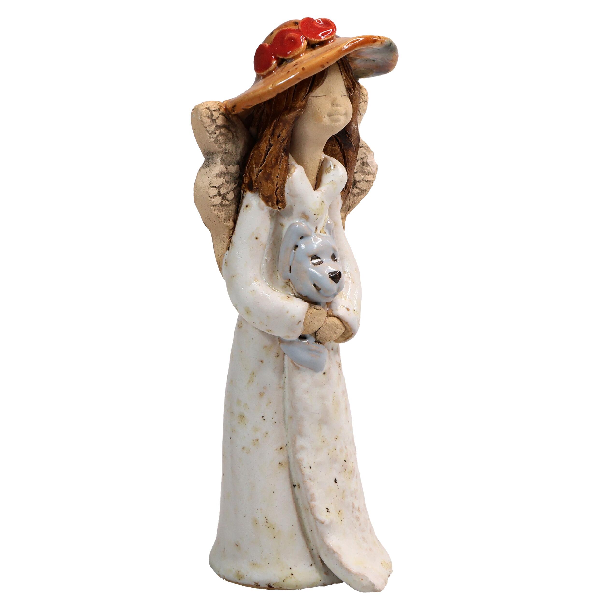Handmade ceramic angel in white dress holding a grey dog, gift-packed. Unique ornament celebrating “The dog makes a house a home.”