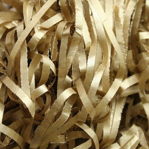 shiny gold tissue paper shredded