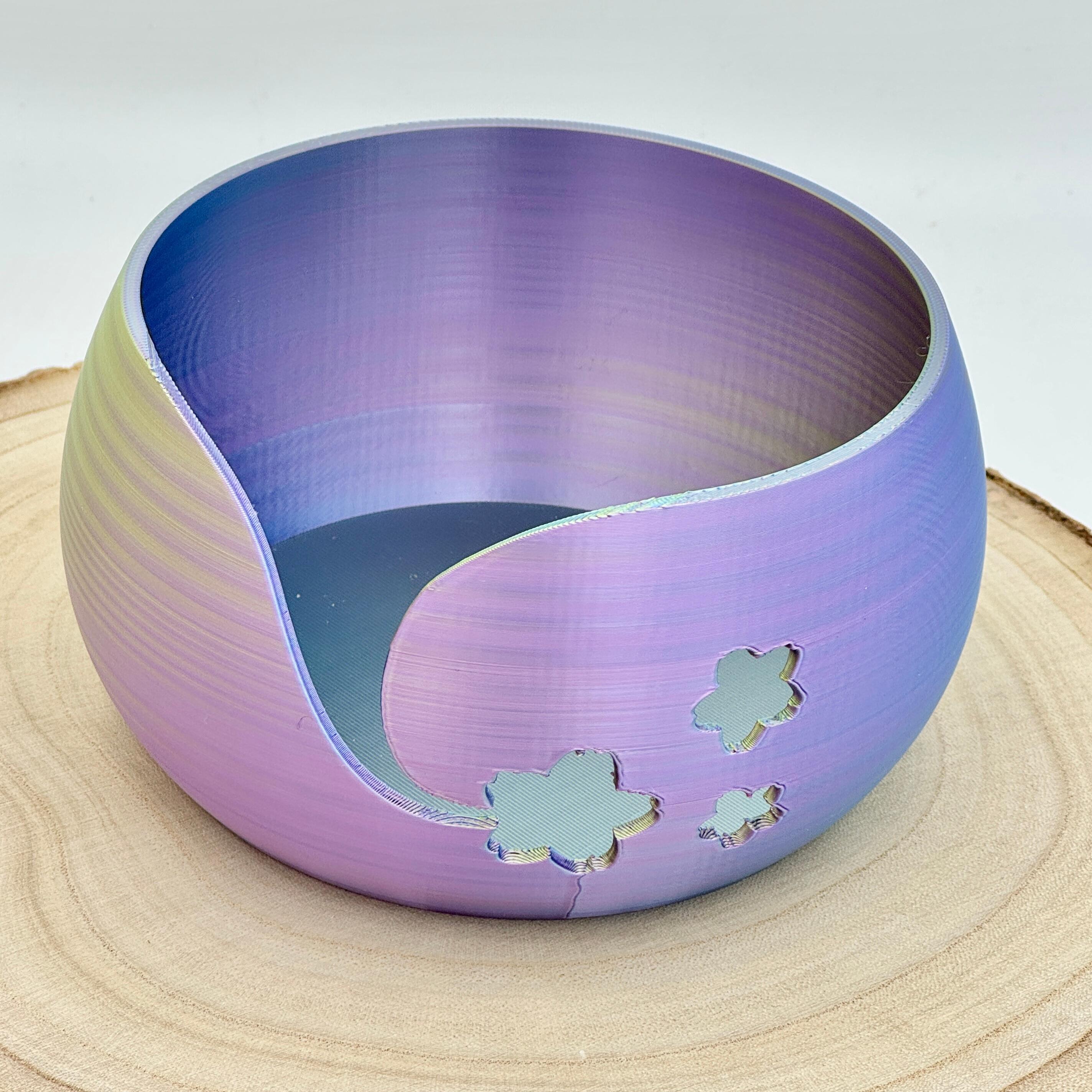 an image of a floral themed yarn bowl in purple & green