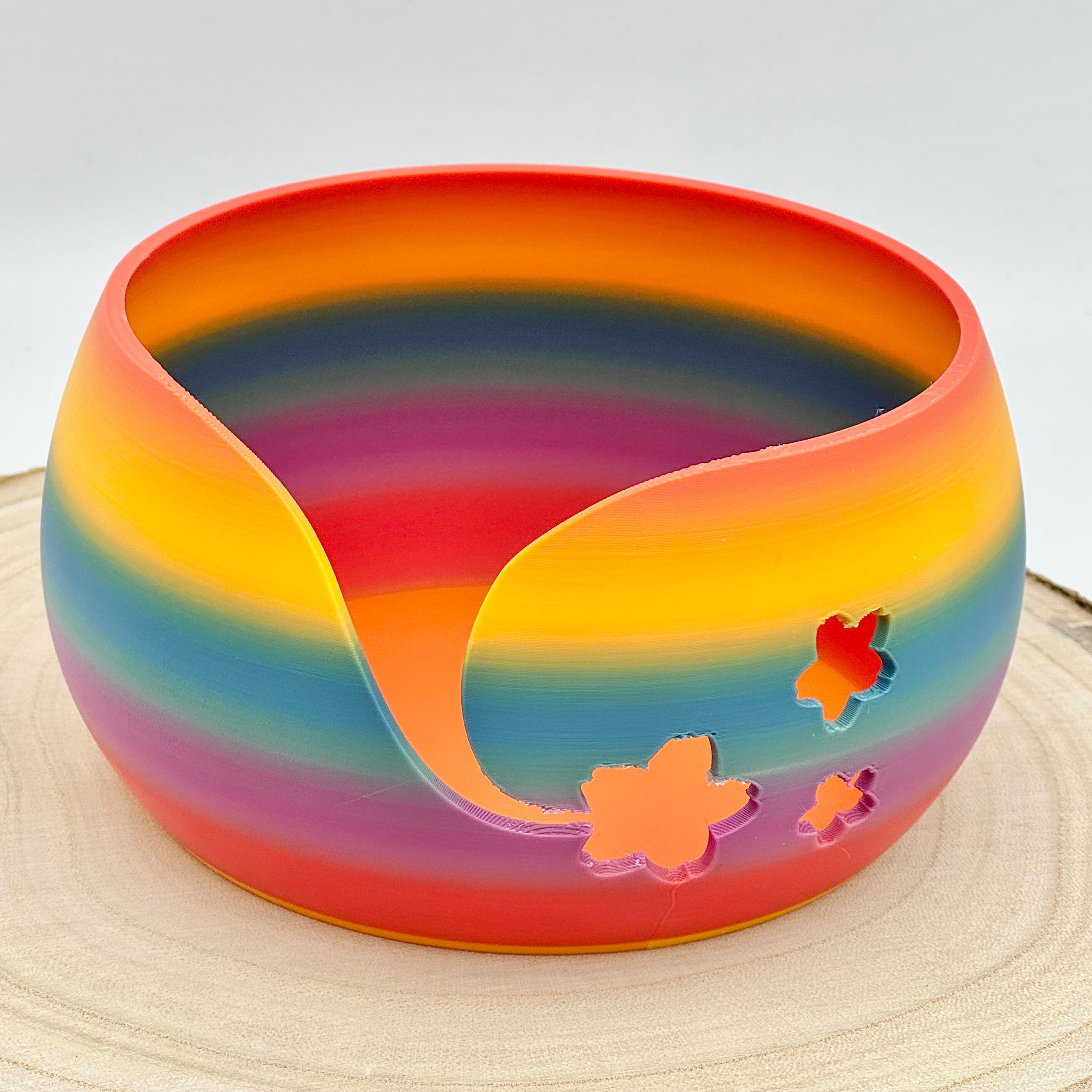 an image of a floral themed yarn bowl in bold rainbow colours