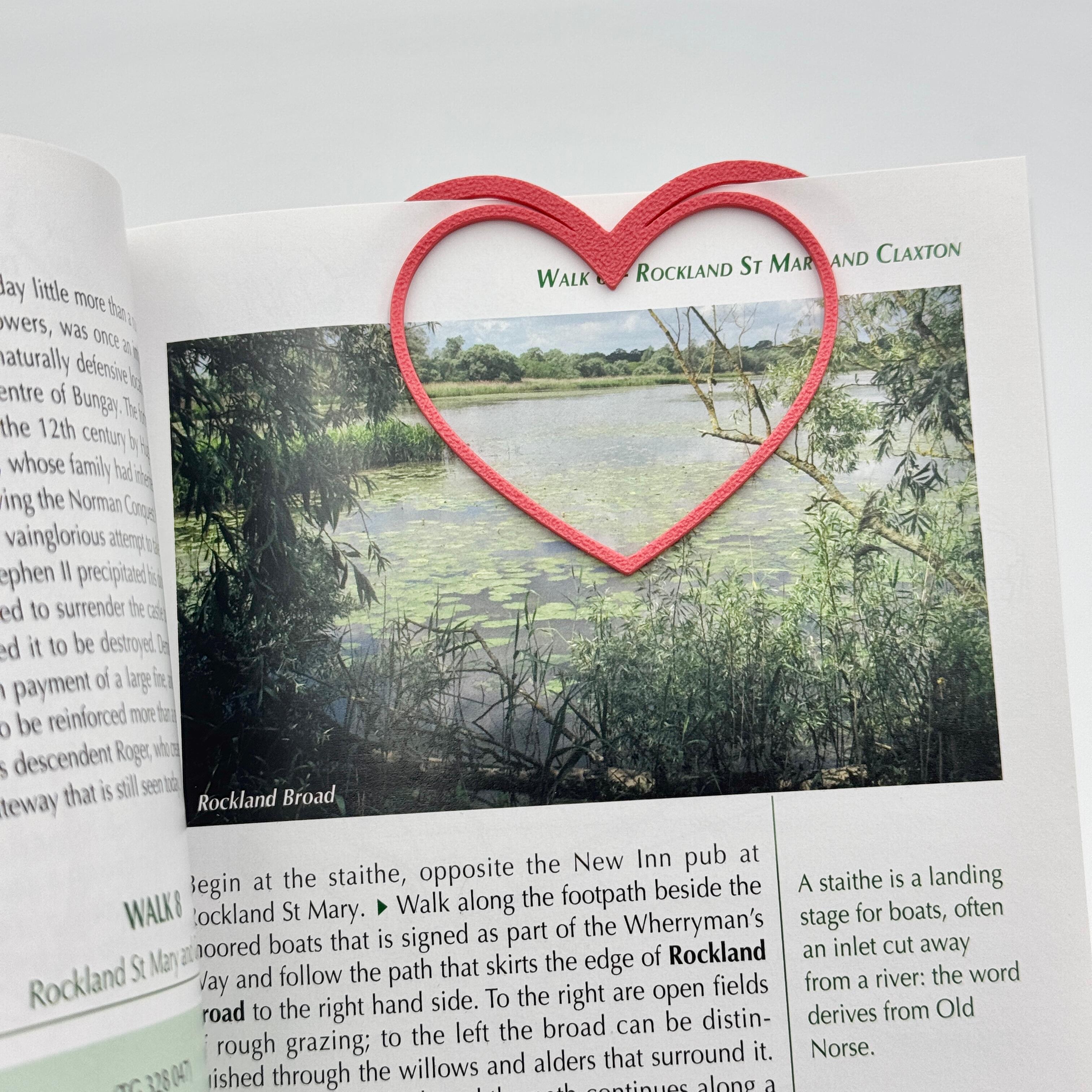 heart shaped bookmark in a book