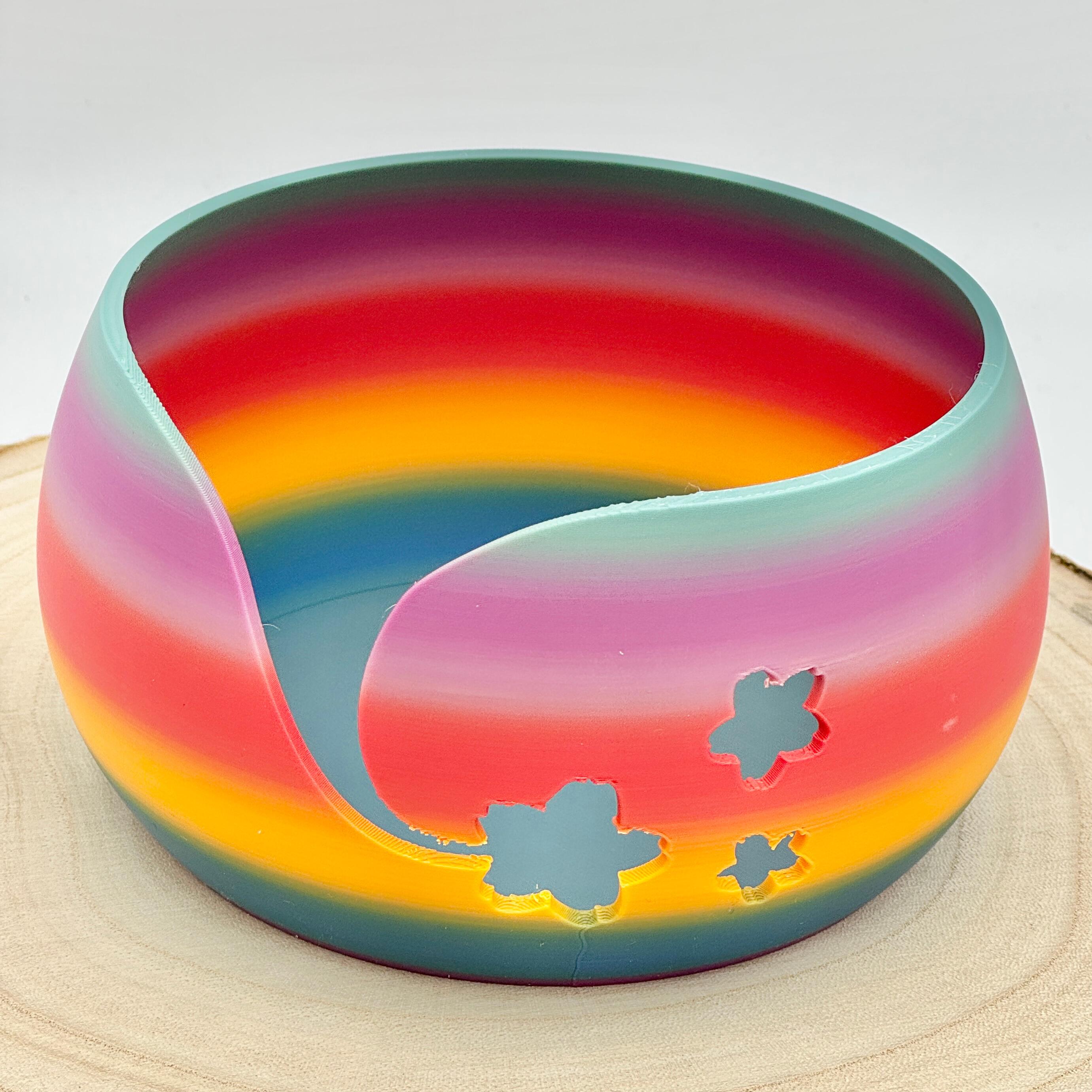 an image of a floral themed yarn bowl in bold rainbow colours