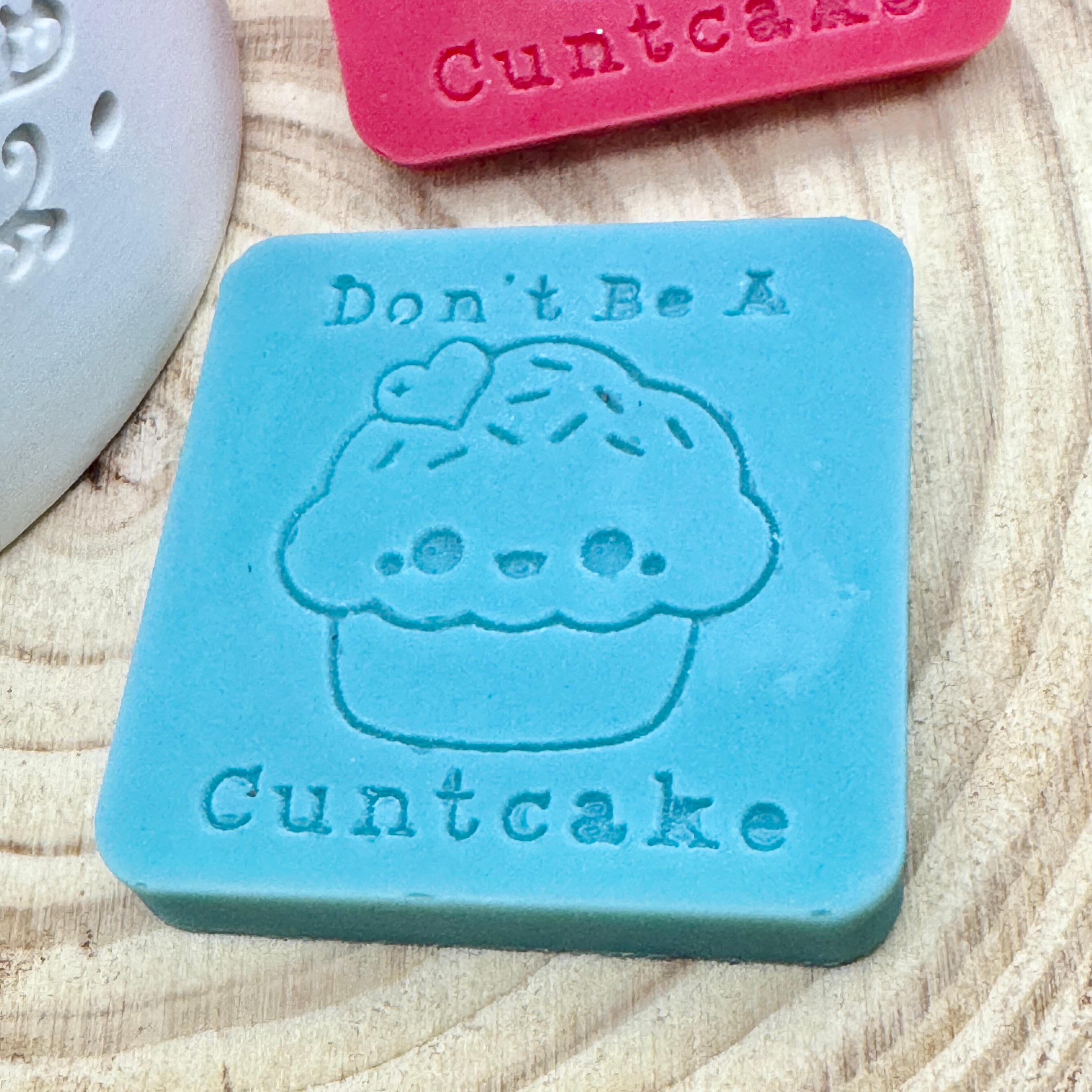 an image of a sweary wax melt square that reads cuntcake
