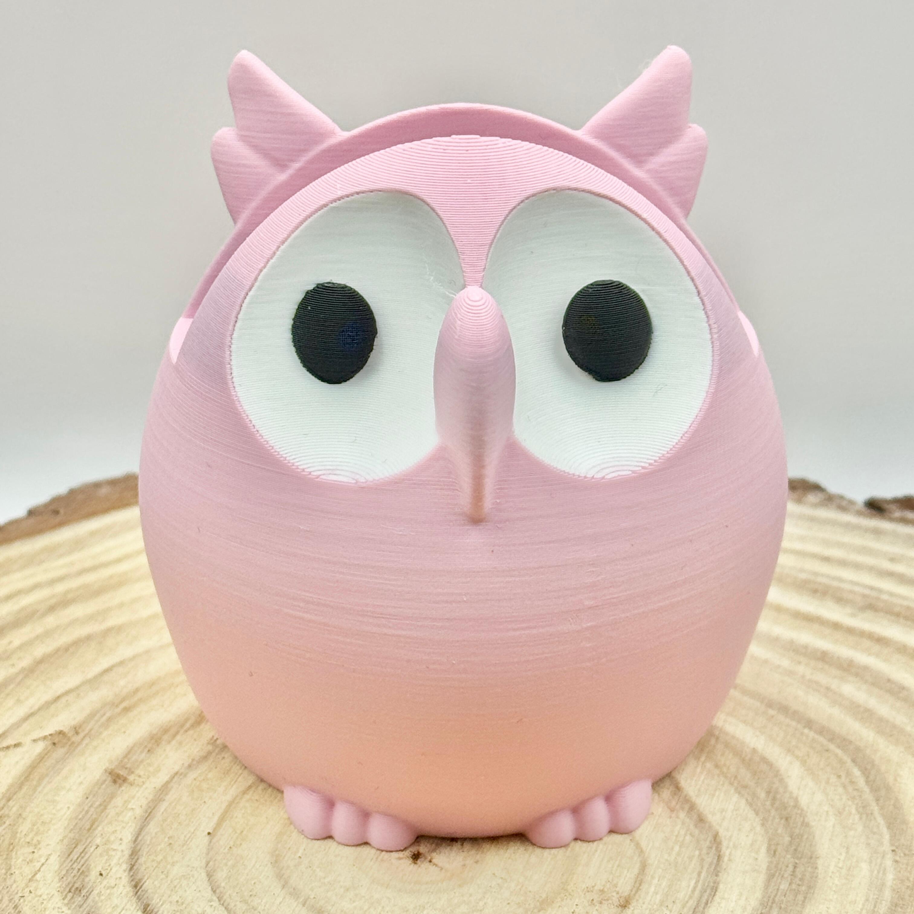 pink owl shaped glasses stand