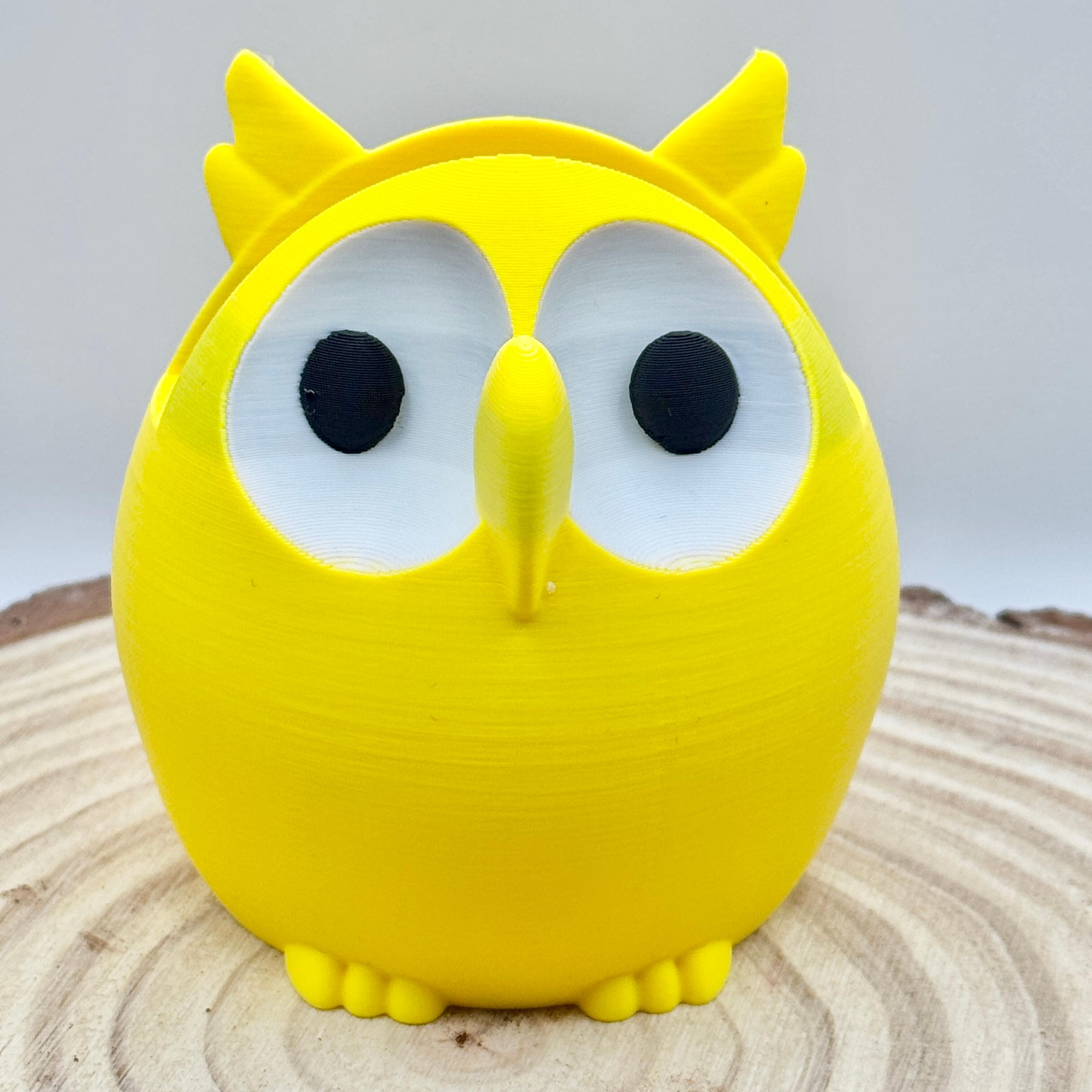 yellow owl shaped glasses stand