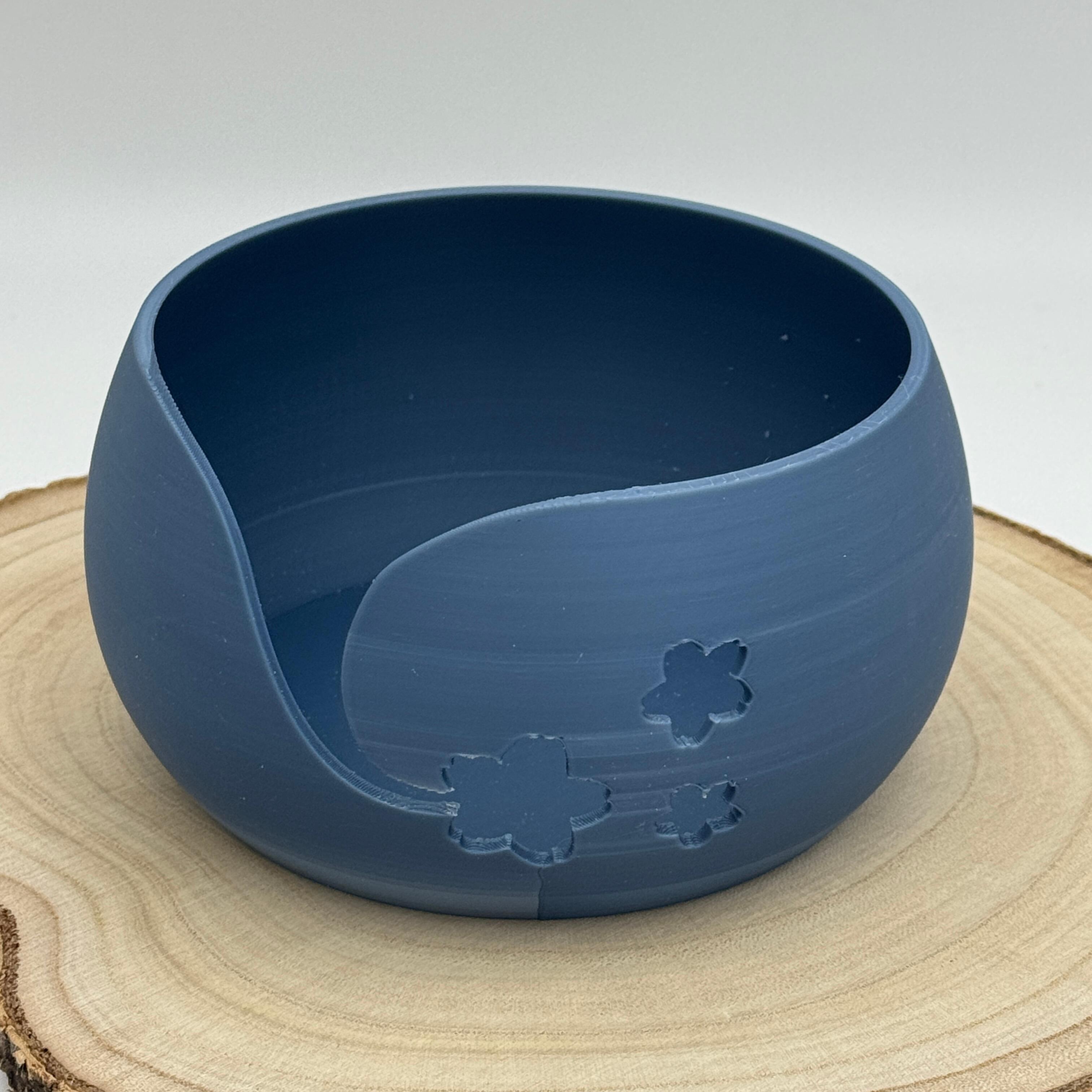 an image of a floral themed yarn bowl in blue grey
