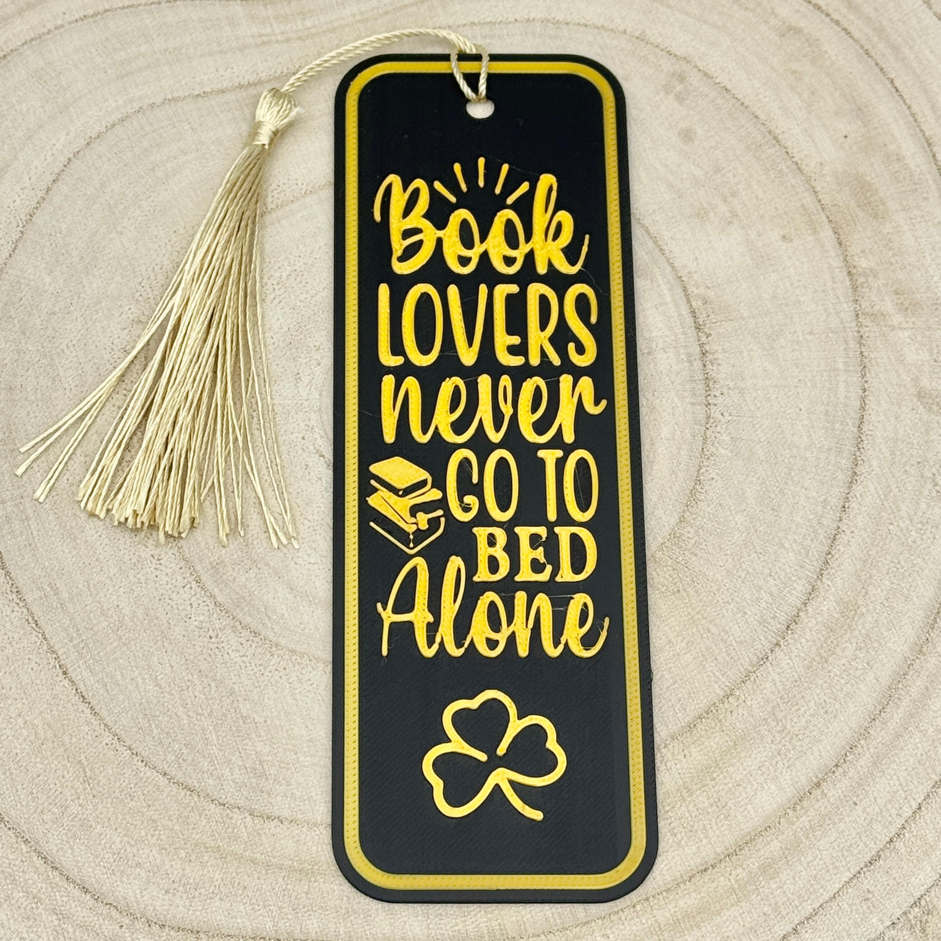 an image of a black and gold book lovers bookmark