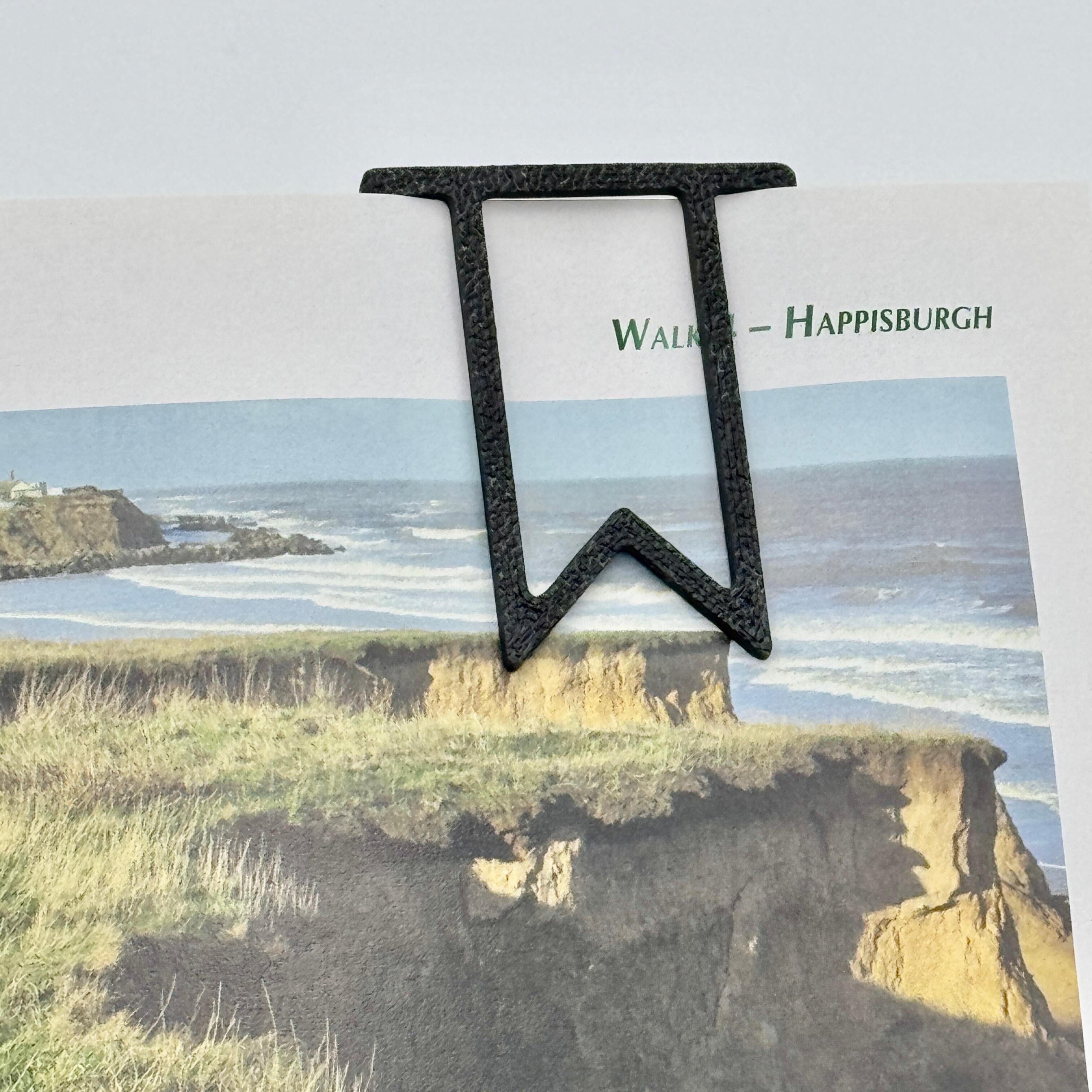 an image of a paperclip bookmark being used
