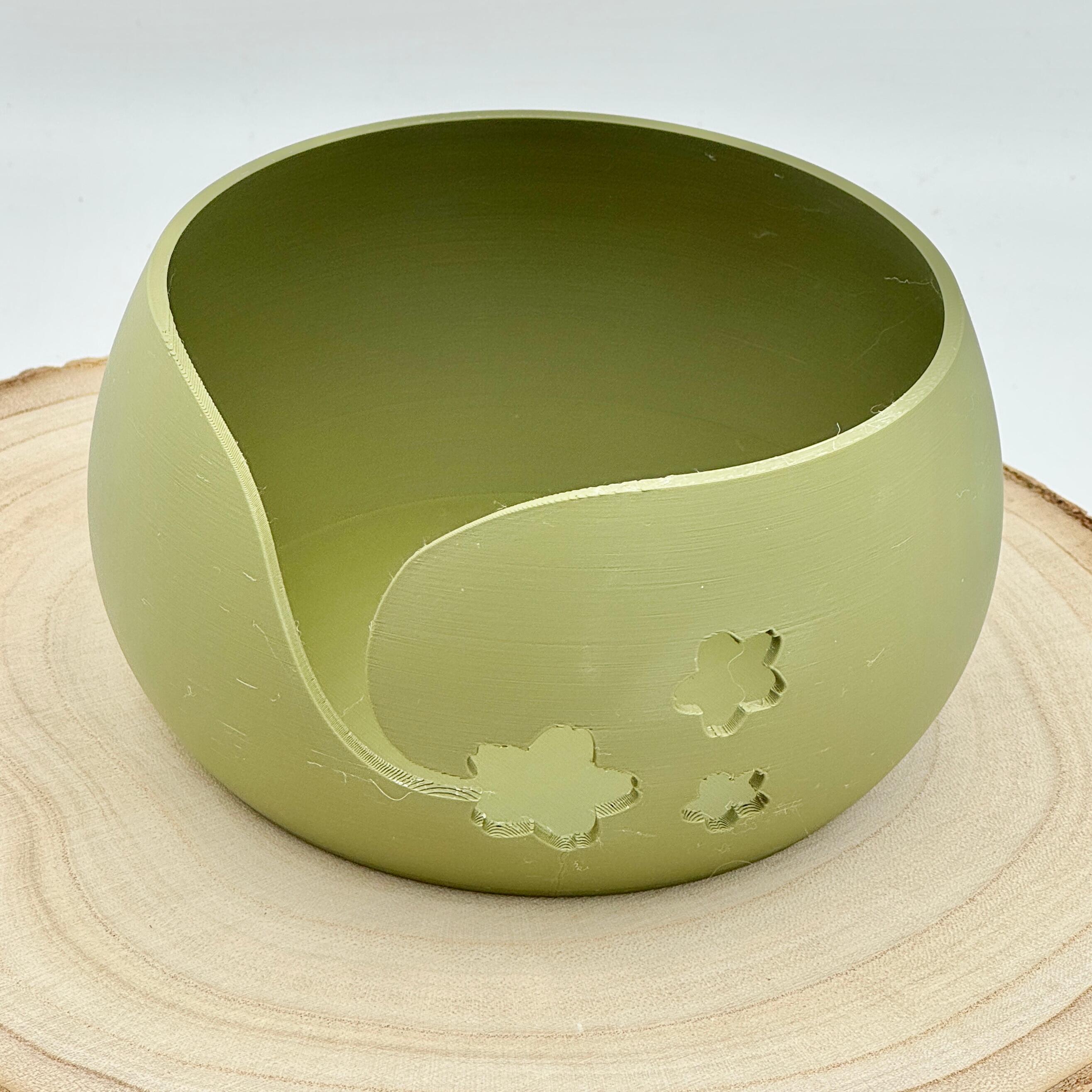 an image of a floral themed yarn bowl in olive green