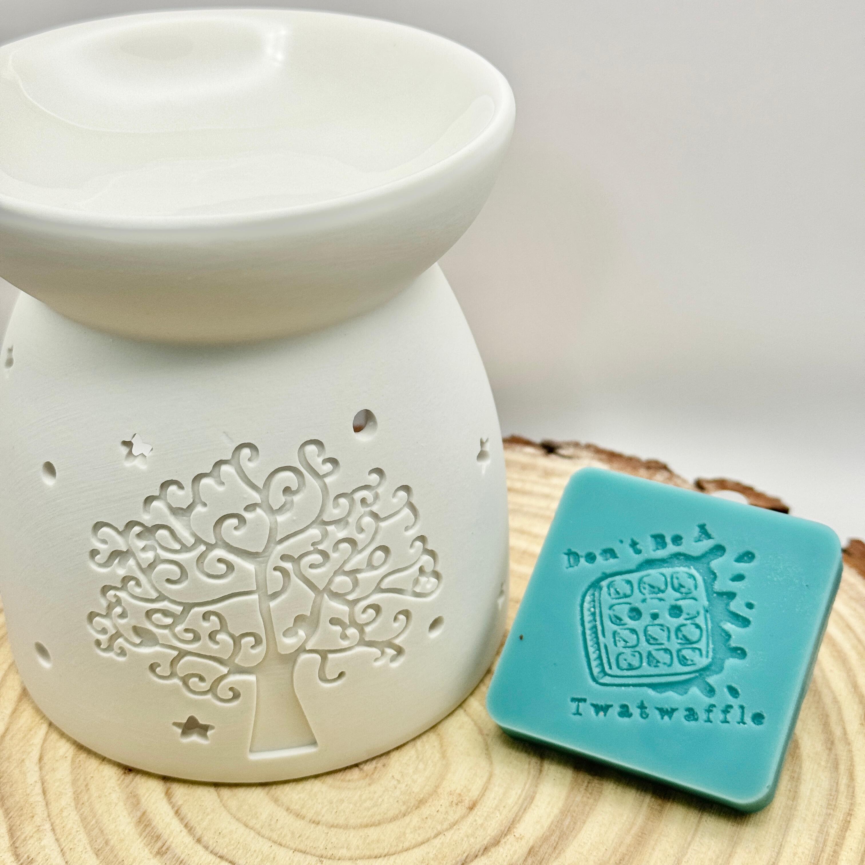 an image of a sweary wax melt square that reads twatwaffle
