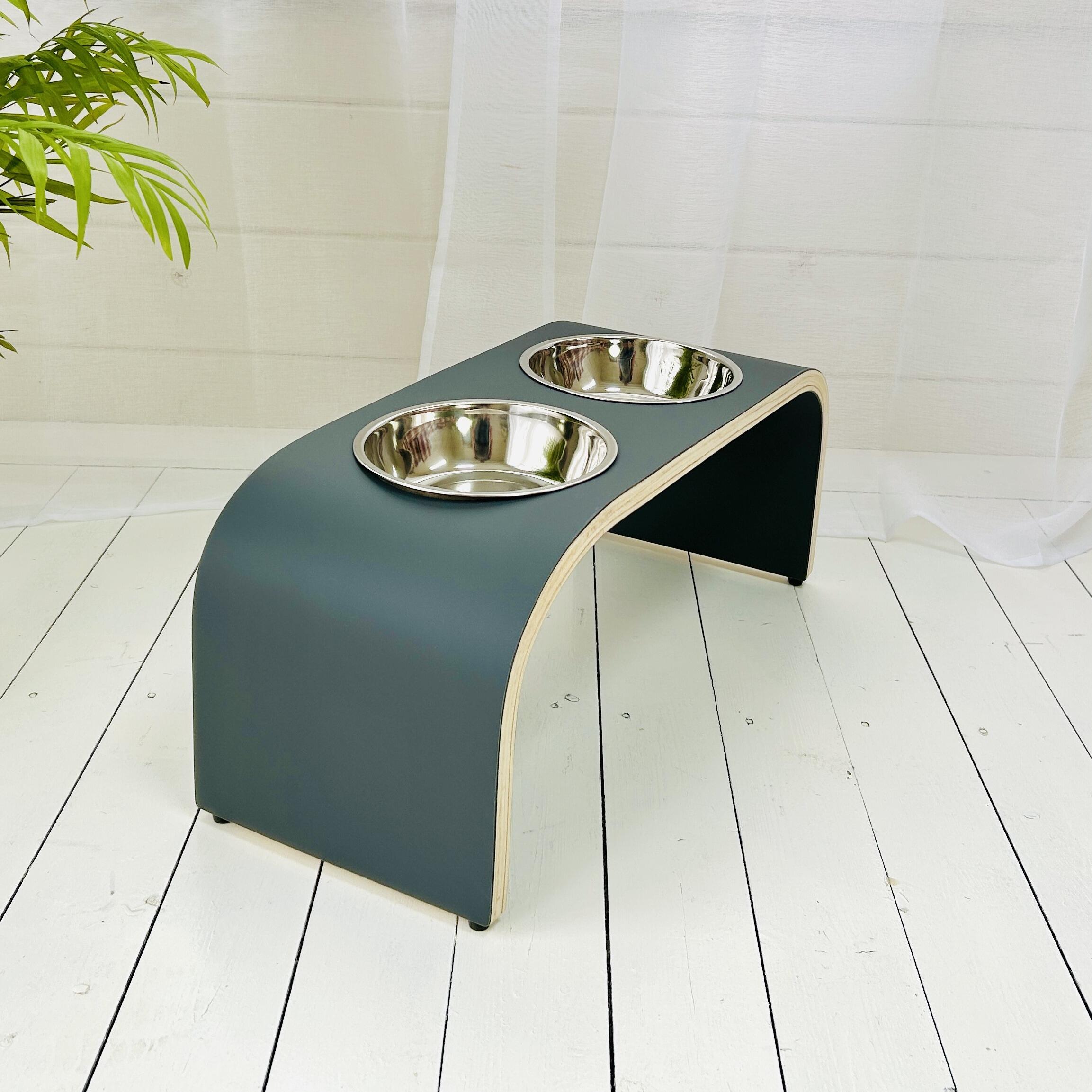side view of big dog feeding station in dark grey finish on white background
