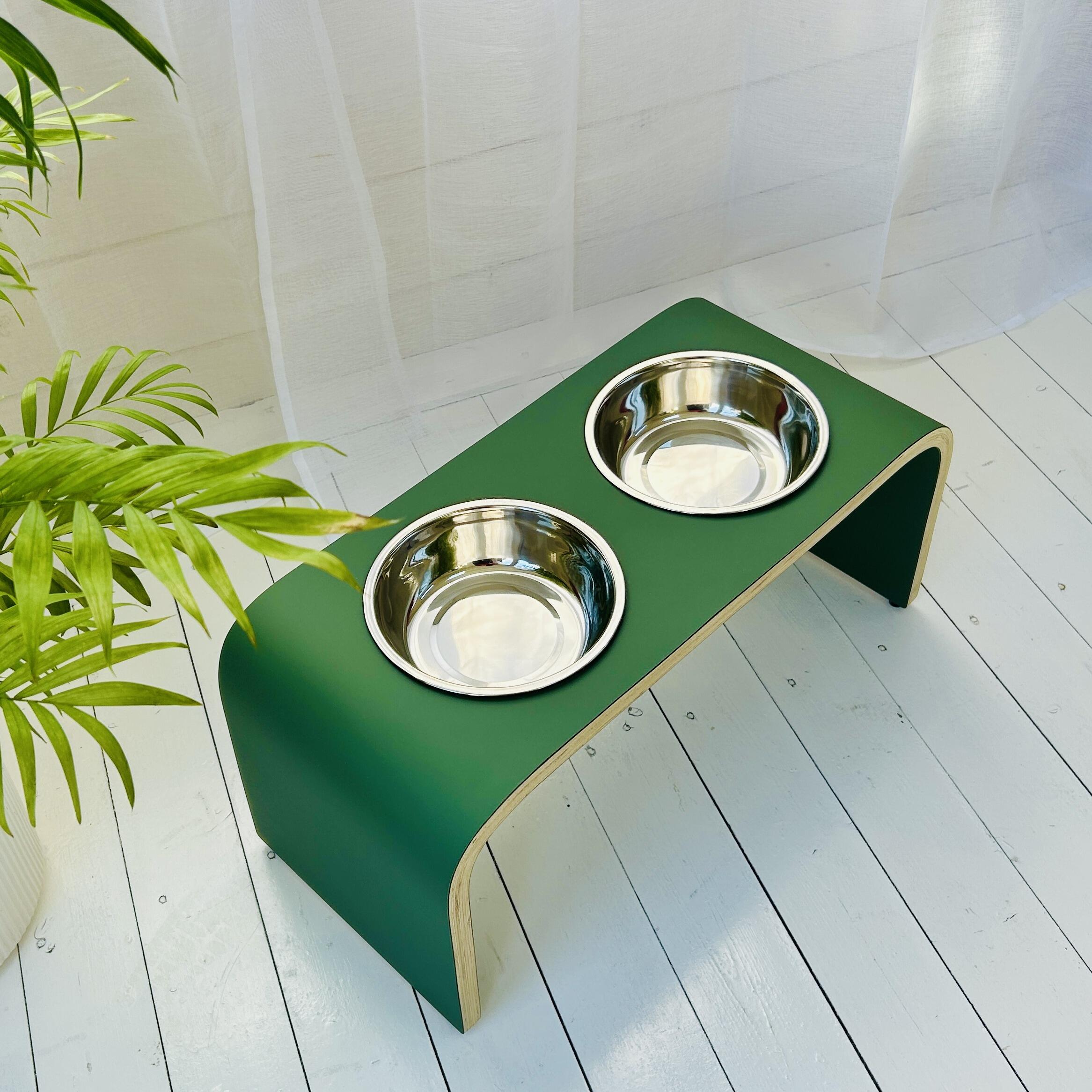 above view of dark green wooden dog bowl stand with stainless steel bowls for dogs