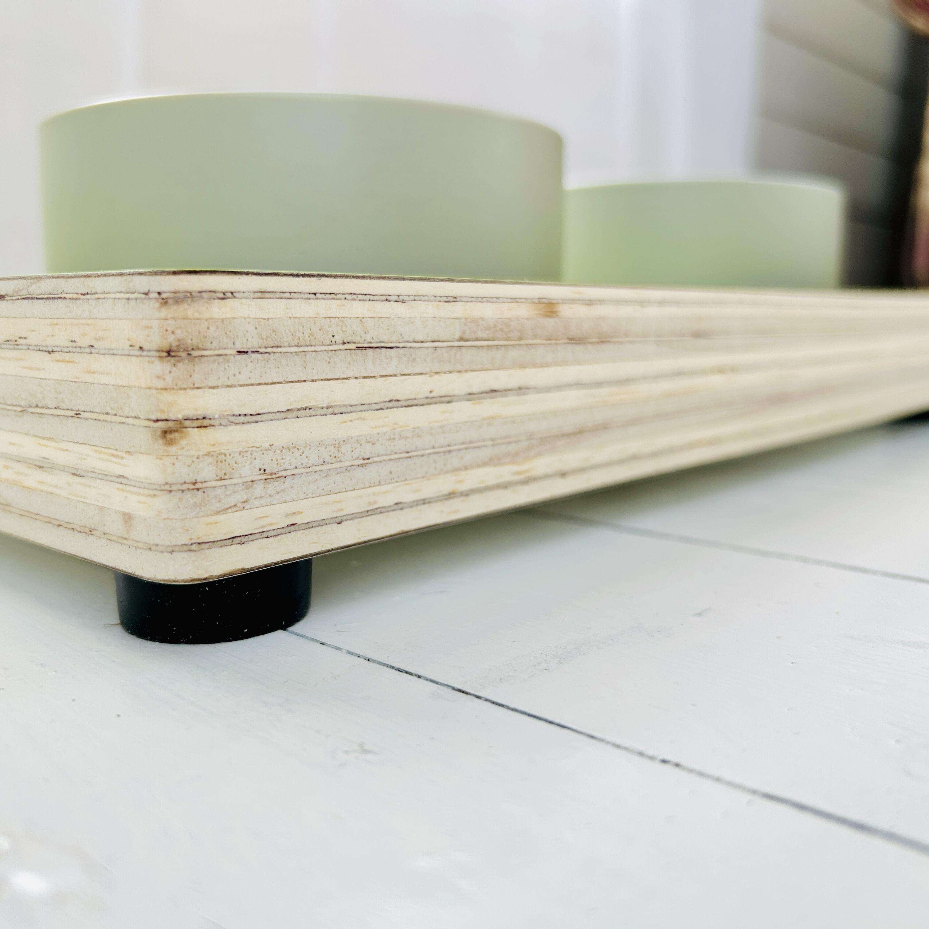 low view of thick wooden edge of ceramic pet feeder