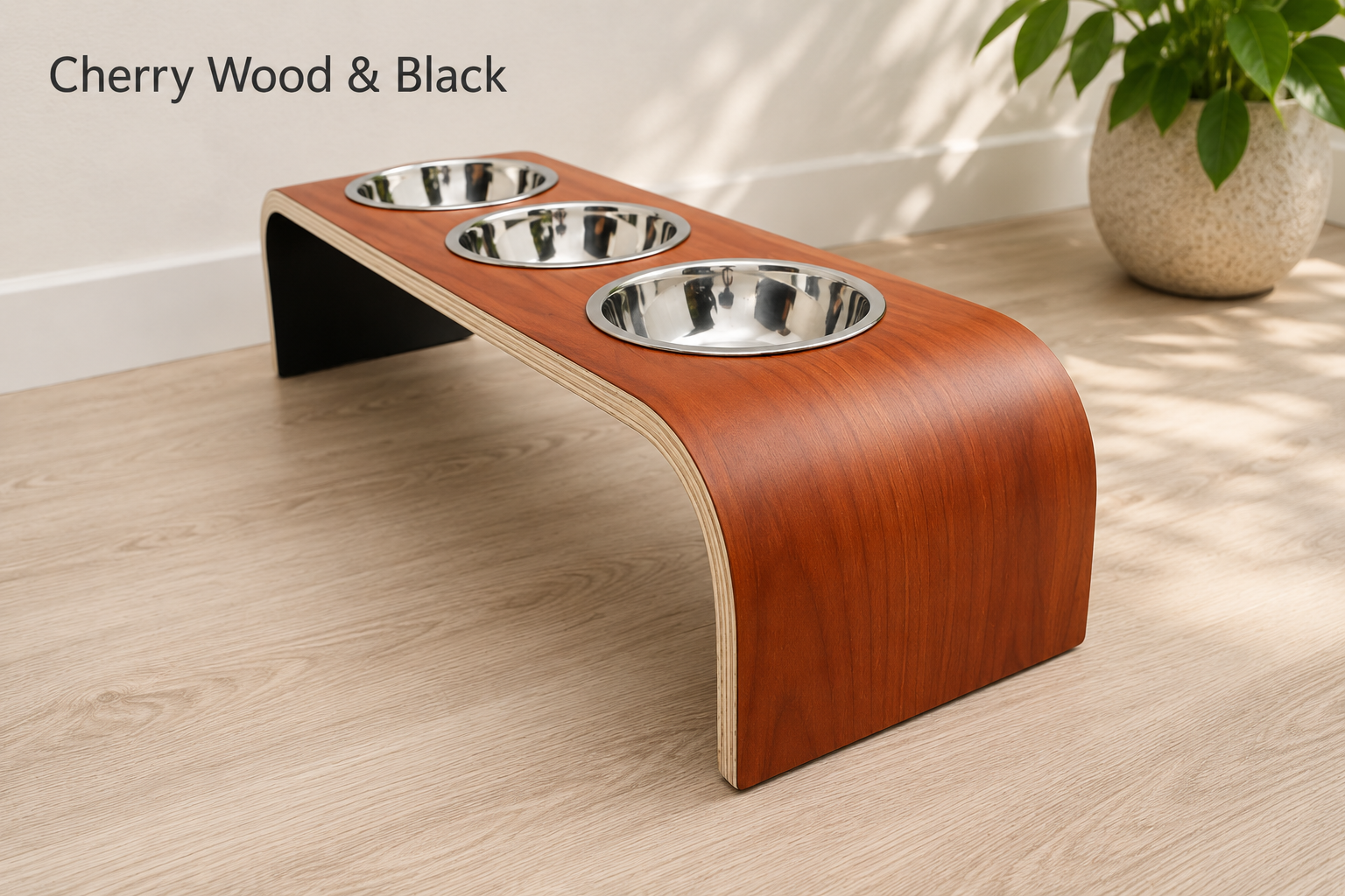 Modern cherry wood raised triple dog bowl stand with stainless steel bowls, handcrafted curved wooden pet feeder for dogs and cats.