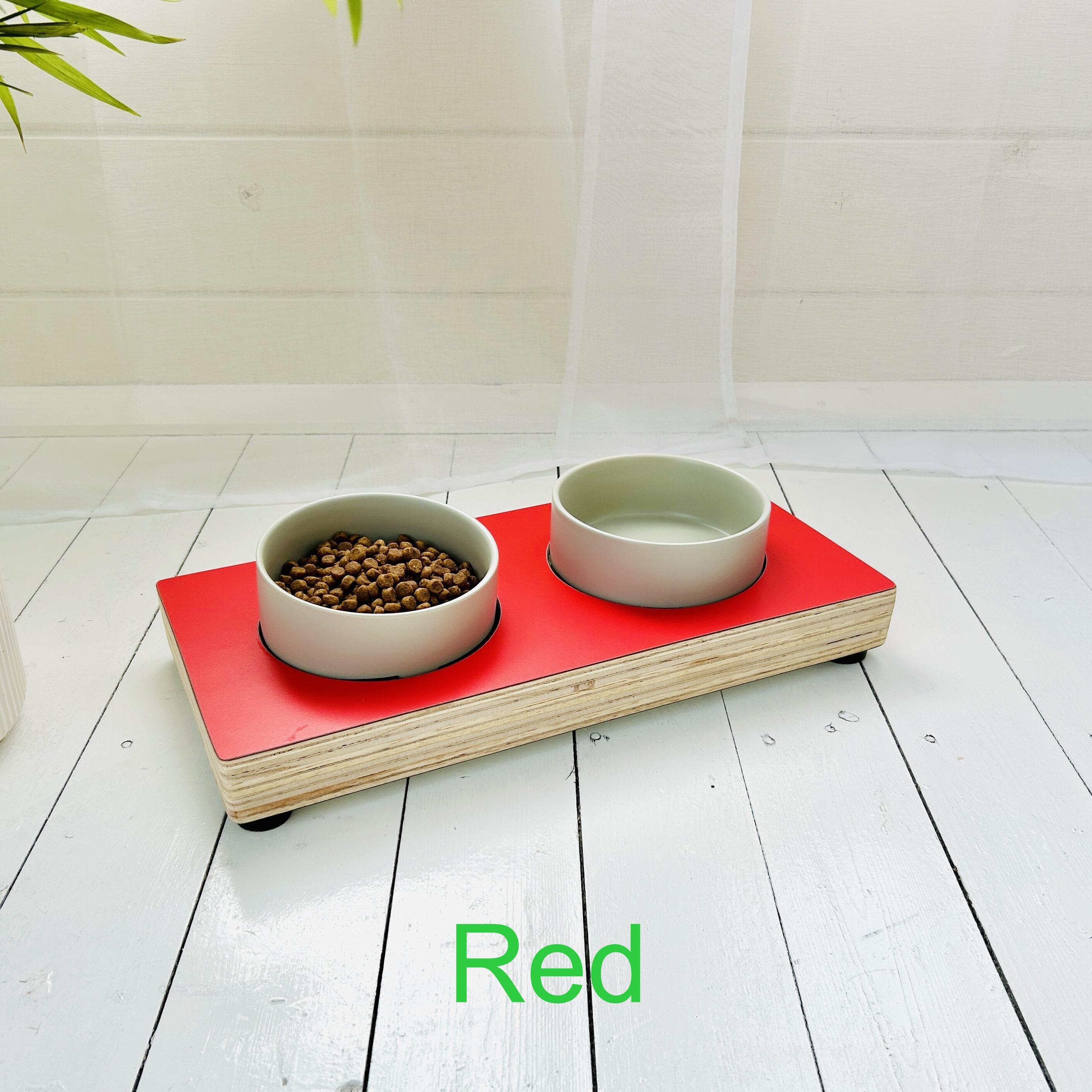 red topped wooden pet feeder showing rubber feet and waxed wooden edges