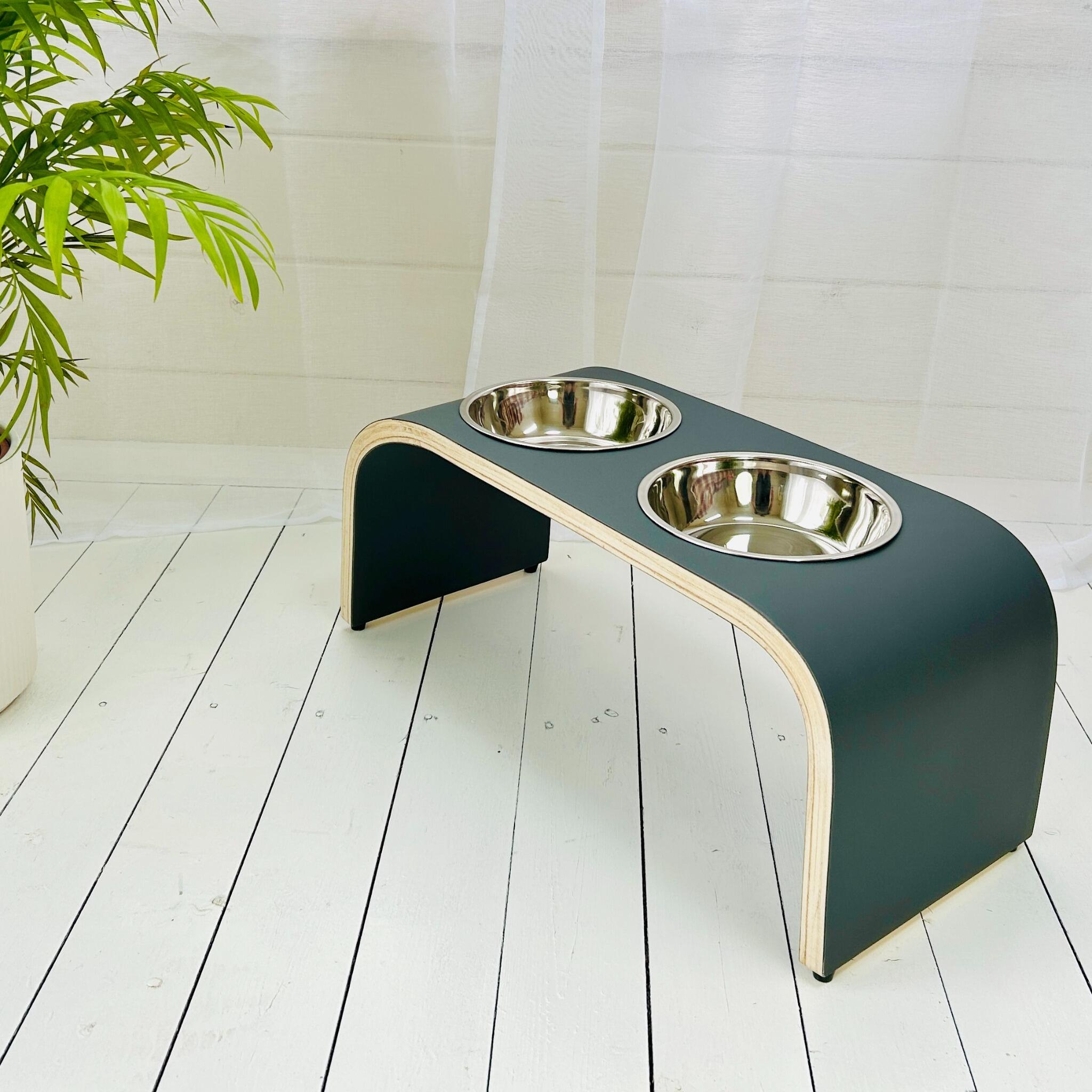 Collage of four handmade Super Matt raised dog bowl stands in black, dark blue, dark grey and dark green finishes with removable stainless steel bowls, handcrafted in Scotland.