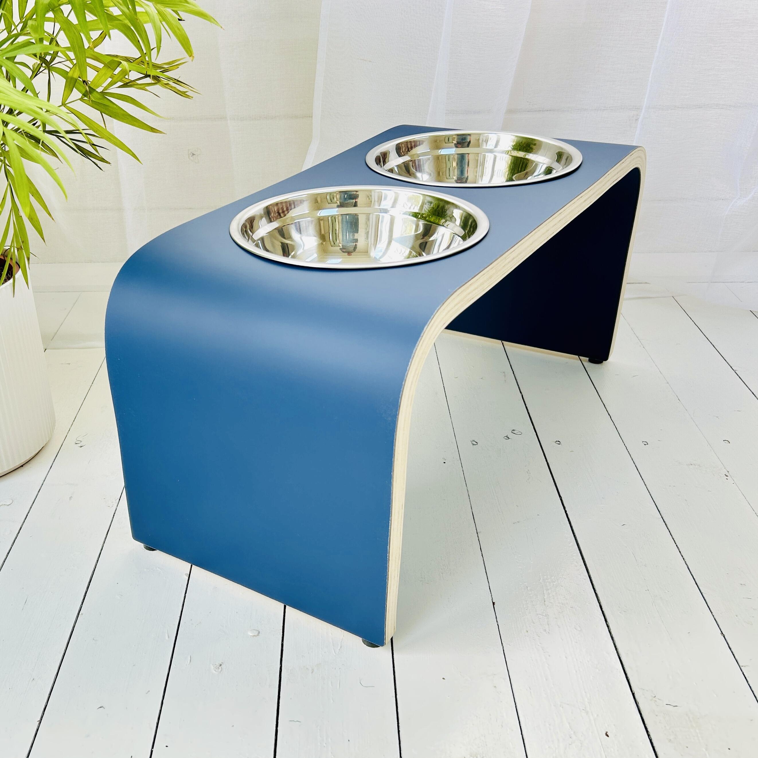 side view of high wooden dog bowl stand in dark blue finish