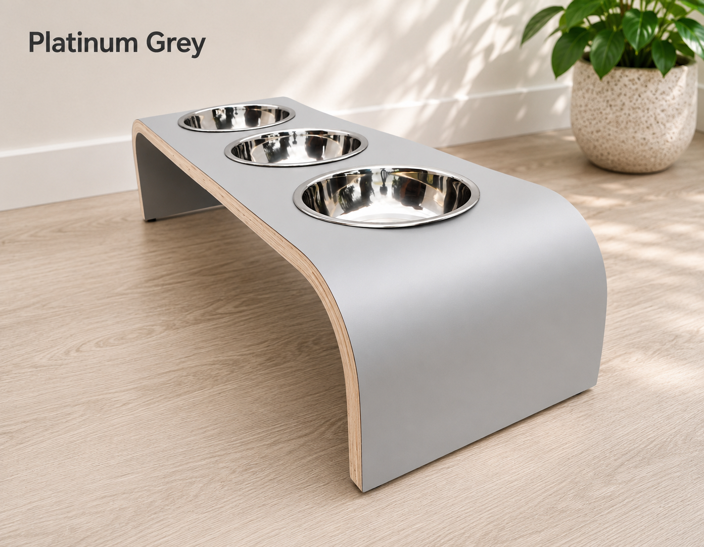 Modern platinum grey raised triple dog bowl stand with stainless steel bowls, handcrafted curved wooden pet feeder for dogs and cats.