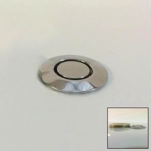 Chrome circular spa jet on white surface with coin size comparison inse
