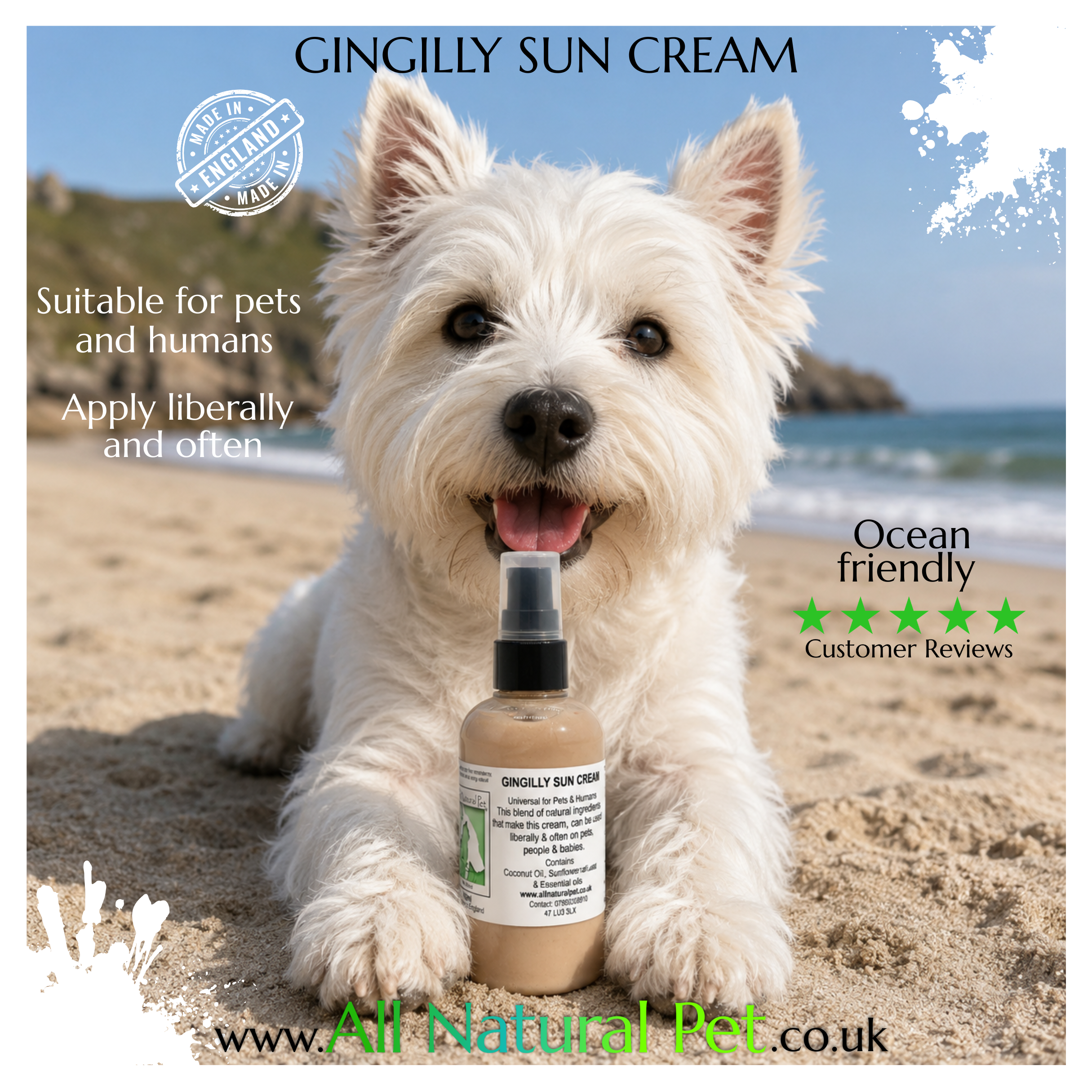 A west highland white terrier dog laying on a sandy beach in front of the ocean and cliffs in the background with a small pump bottle of peach coloured gingely sun lotion in front of the dog