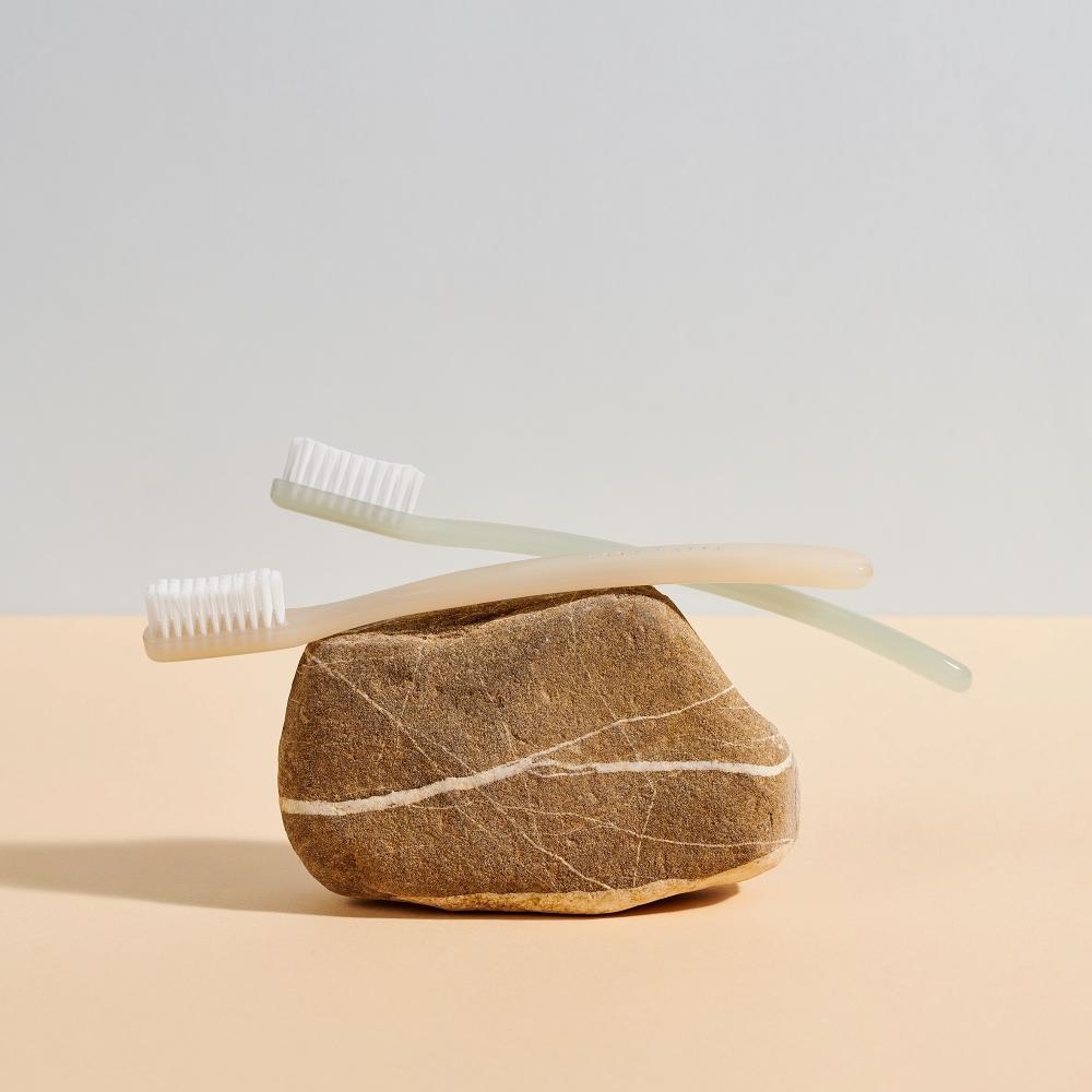 Pictured: The Eco-Sustainable EYE Collection by Acca Kappa, Ivory and Green Toothbrushes.