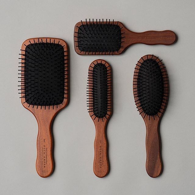 Pictured: The Acca Kappa Classic collection brushes, featuring detangling pom pins.