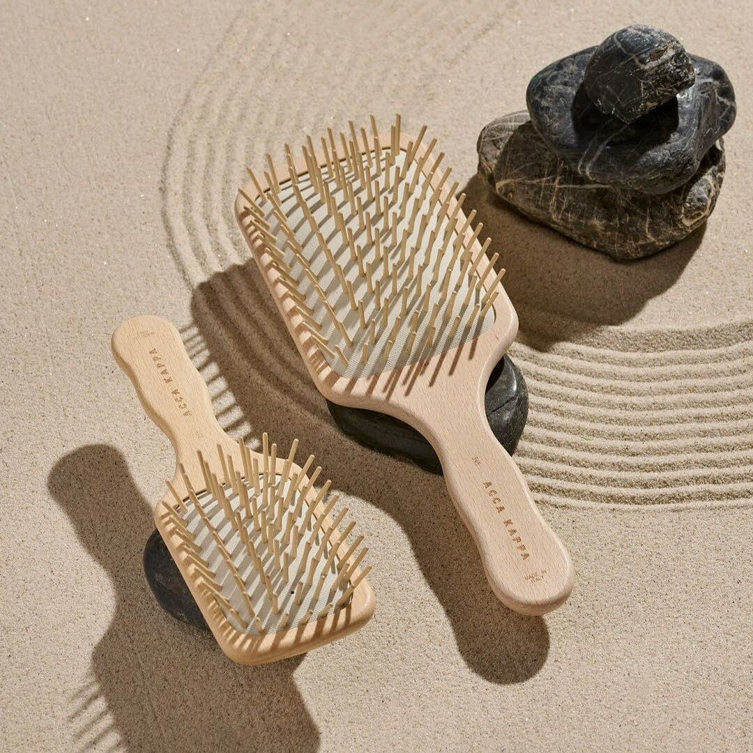 Pictured: The Natura Paddle Brush in Regular and Travel-Size.