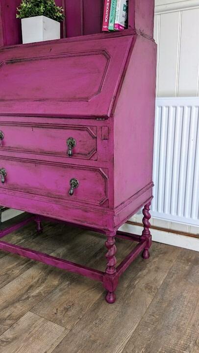 A side view of a vintage writing bureau