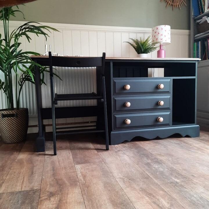 Large black upcycled desk in black with a wooden top and gold handles