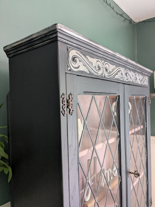 black writing bureau with bookcase