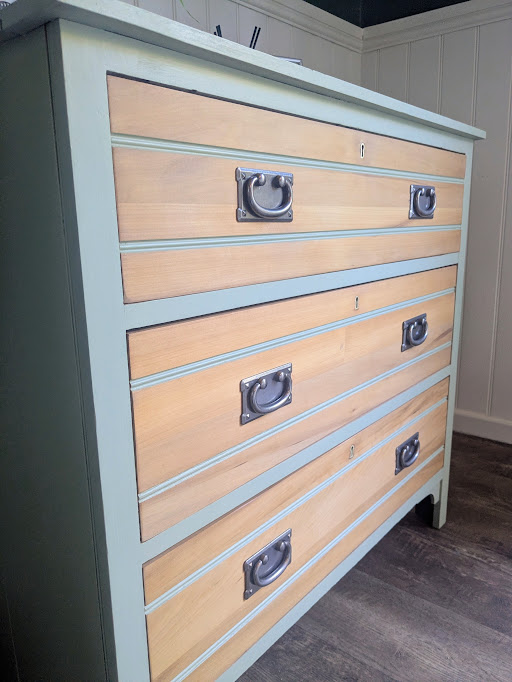 green and wood chest of drawers