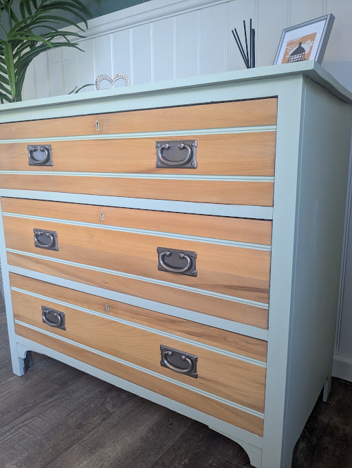 green chest of drawers with wood fronts