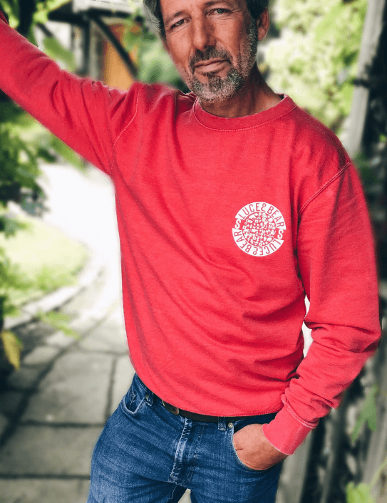 Man wearing fire red Power Patch sweat