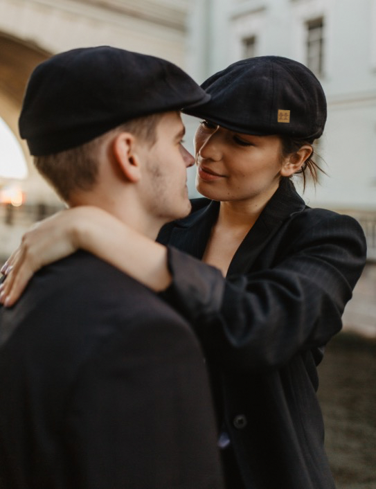 Man and woman wearing charcoal Wool Zac Cap