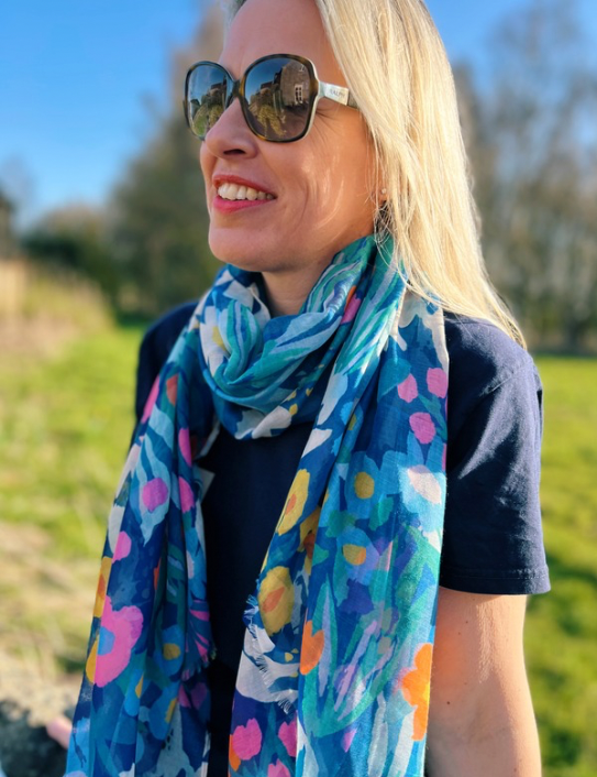 Woman wearing blue Flower Power Scarf