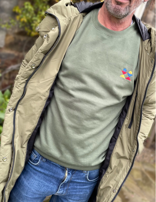 Man wearing earth green logo sweat